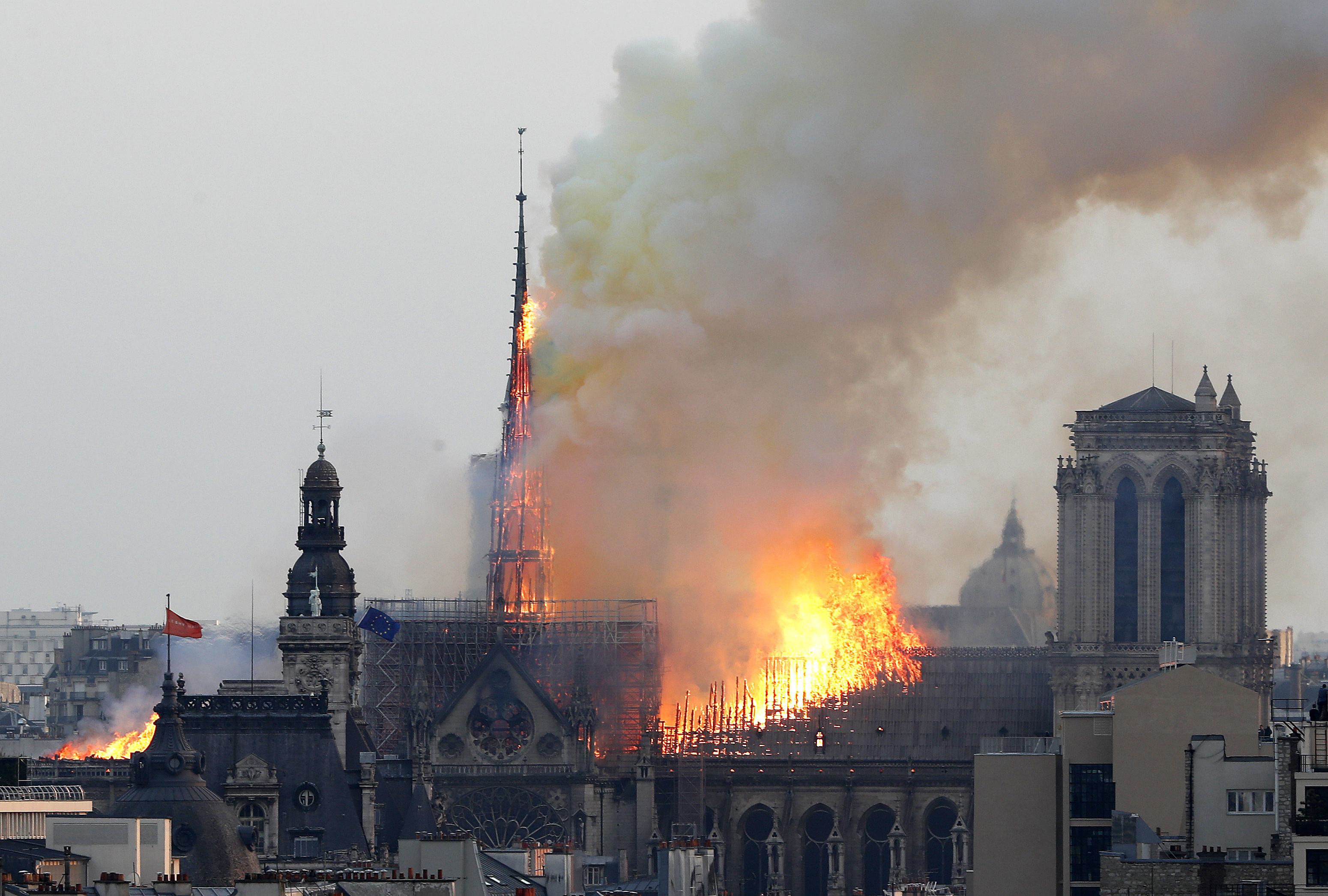 Flames rise from Notre Dame cathedral as it burns in Paris, Monday, April 15, 2019. Massive plumes of yellow brown smoke is filling the air above Notre Dame Cathedral and ash is falling on tourists and others around the island that marks the center of Paris. (AP Photo/Thibault Camus) Flames rise from Notre Dame cathedral as it burns in Paris, Monday, April 15, 2019. Massive plumes of yellow brown smoke is filling the air above Notre Dame Cathedral and ash is falling on tourists and others around the island that marks the center of Paris. (AP Photo/Thibault Camus)