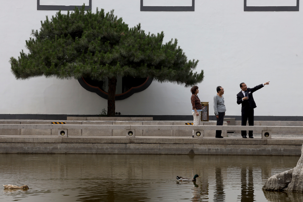 Hotel staff gives directions to visitors as ducks swim in a pond at the Xiangshan hotel designed by Chinese-American architect I.M. Pei and built in 1982 in Beijing, China on Friday, May 17, 2019. Pei, the globe-trotting architect who revived the Louvre museum in Paris with a giant glass pyramid and captured the spirit of rebellion at the multi-shaped Rock and Roll Hall of Fame, has died at age 102, a spokesman confirmed Thursday. (AP Photos/Ng Han Guan) Hotel staff gives directions to visitors as ducks swim in a pond at the Xiangshan hotel designed by Chinese-American architect I.M. Pei and built in 1982 in Beijing, China on Friday, May 17, 2019. Pei, the globe-trotting architect who revived the Louvre museum in Paris with a giant glass pyramid and captured the spirit of rebellion at the multi-shaped Rock and Roll Hall of Fame, has died at age 102, a spokesman confirmed Thursday. (AP Photos/Ng Han Guan)