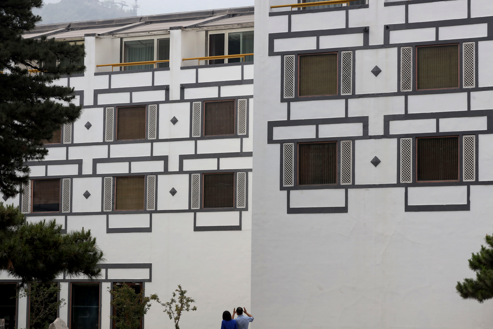A visitor looks at the architecture of the Xiangshan hotel designed by Chinese-American architect I.M. Pei and built in 1982 in Beijing, China on Friday, May 17, 2019. Pei, the globe-trotting architect who revived the Louvre museum in Paris with a giant glass pyramid and captured the spirit of rebellion at the multi-shaped Rock and Roll Hall of Fame, has died at age 102, a spokesman confirmed Thursday. (AP Photos/Ng Han Guan) A visitor looks at the architecture of the Xiangshan hotel designed by Chinese-American architect I.M. Pei and built in 1982 in Beijing, China on Friday, May 17, 2019. Pei, the globe-trotting architect who revived the Louvre museum in Paris with a giant glass pyramid and captured the spirit of rebellion at the multi-shaped Rock and Roll Hall of Fame, has died at age 102, a spokesman confirmed Thursday. (AP Photos/Ng Han Guan)