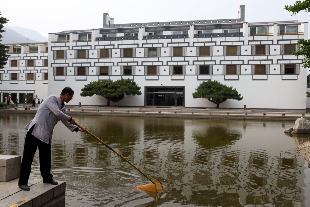 A worker cleans the pond at the Xiangshan hotel designed by Chinese-American architect I.M. Pei and built in 1982 in Beijing, China on Friday, May 17, 2019. Pei, the globe-trotting architect who revived the Louvre museum in Paris with a giant glass pyramid and captured the spirit of rebellion at the multi-shaped Rock and Roll Hall of Fame, has died at age 102, a spokesman confirmed Thursday. (AP Photos/Ng Han Guan) A worker cleans the pond at the Xiangshan hotel designed by Chinese-American architect I.M. Pei and built in 1982 in Beijing, China on Friday, May 17, 2019. Pei, the globe-trotting architect who revived the Louvre museum in Paris with a giant glass pyramid and captured the spirit of rebellion at the multi-shaped Rock and Roll Hall of Fame, has died at age 102, a spokesman confirmed Thursday. (AP Photos/Ng Han Guan)