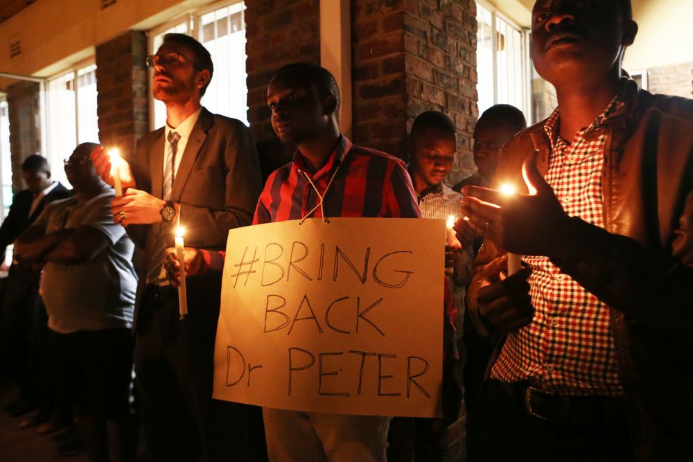 A night vigil prayer is held for a missing doctor, Peter Magombeyi, by well wishers and fellow doctors at Harare hospital in Zimbabwe Tuesday, Sept,17, 2019. The Zimbabwe Hospitals Association has said that that their president, Peter Magombeyi, was abducted on Saturday, days after receiving threats on his phone. Magombeyi had expressed concerns to journalists about the poor state of Zimbabwe,s hospitals.(AP Photo/Tsvangirayi Mukwazhi) A night vigil prayer is held for a missing doctor, Peter Magombeyi, by well wishers and fellow doctors at Harare hospital in Zimbabwe Tuesday, Sept,17, 2019. The Zimbabwe Hospitals Association has said that that their president, Peter Magombeyi, was abducted on Saturday, days after receiving threats on his phone. Magombeyi had expressed concerns to journalists about the poor state of Zimbabwe,s hospitals.(AP Photo/Tsvangirayi Mukwazhi)