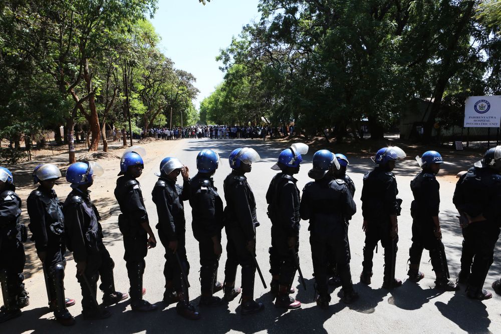 Armed riot police block the road as doctors attempt to march in Harare, Wednesday, Sept, 18, 2019. Zimbabwean doctors protesting the alleged abduction of a union leader were met by a line of baton- wielding police in the capital as fears grow about government repression. (AP Photo/Tsvangirayi Mukwazhi) Armed riot police block the road as doctors attempt to march in Harare, Wednesday, Sept, 18, 2019. Zimbabwean doctors protesting the alleged abduction of a union leader were met by a line of baton- wielding police in the capital as fears grow about government repression. (AP Photo/Tsvangirayi Mukwazhi)