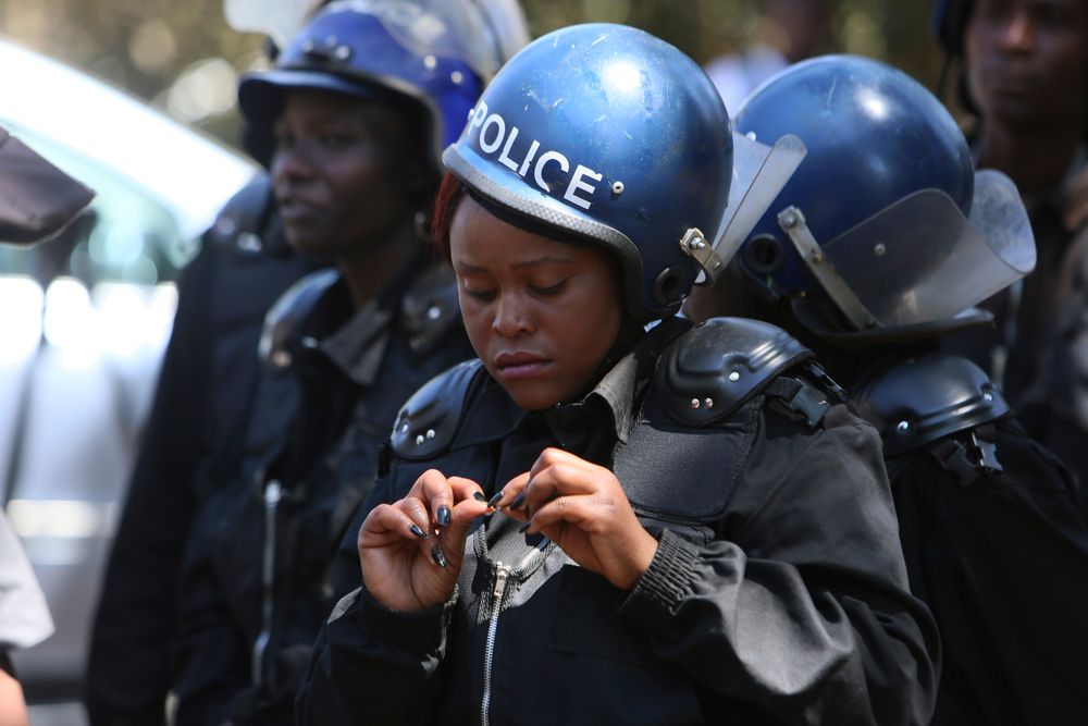 Armed riot police block doctors as they protest in Harare, Wednesday, Sept, 18, 2019. Zimbabwean doctors protesting the alleged abduction of a union leader were met by a line of baton- wielding police in the capital as fears grow about government repression. (AP Photo/Tsvangirayi Mukwazhi) Armed riot police block doctors as they protest in Harare, Wednesday, Sept, 18, 2019. Zimbabwean doctors protesting the alleged abduction of a union leader were met by a line of baton- wielding police in the capital as fears grow about government repression. (AP Photo/Tsvangirayi Mukwazhi)