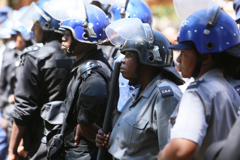 Armed riot police block doctors as they protest in Harare, Wednesday, Sept, 18, 2019. Zimbabwean doctors protesting the alleged abduction of a union leader were met by a line of baton- wielding police in the capital as fears grow about government repression. (AP Photo/Tsvangirayi Mukwazhi) Armed riot police block doctors as they protest in Harare, Wednesday, Sept, 18, 2019. Zimbabwean doctors protesting the alleged abduction of a union leader were met by a line of baton- wielding police in the capital as fears grow about government repression. (AP Photo/Tsvangirayi Mukwazhi)