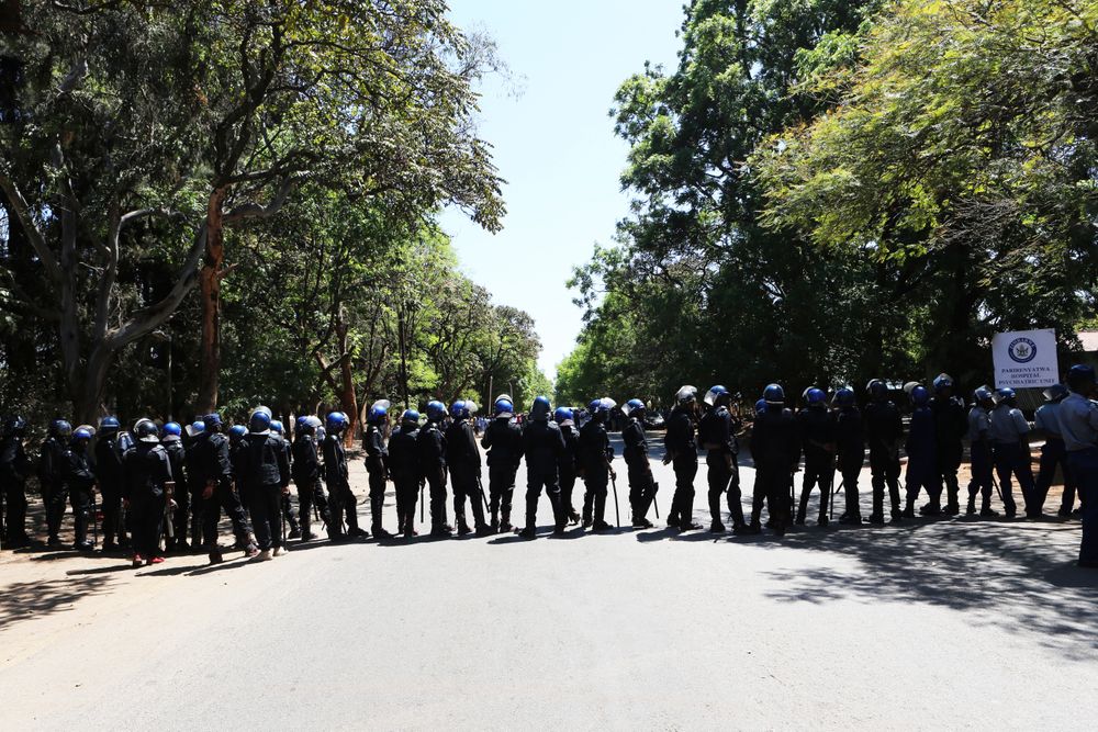 Armed riot police block the road as doctors attempt to march in Harare, Wednesday, Sept, 18, 2019. Zimbabwean doctors protesting the alleged abduction of a union leader were met by a line of baton- wielding police in the capital as fears grow about government repression. (AP Photo/Tsvangirayi Mukwazhi) Armed riot police block the road as doctors attempt to march in Harare, Wednesday, Sept, 18, 2019. Zimbabwean doctors protesting the alleged abduction of a union leader were met by a line of baton- wielding police in the capital as fears grow about government repression. (AP Photo/Tsvangirayi Mukwazhi)