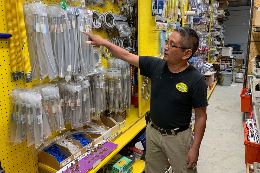In this photo taken Wednesday, Aug. 28, 2019, Albert Chow, owner of Great Wall Hardware in San Francisco, points to steel faucet parts, whose prices have increased because of US tariffs on Chinese imports. He had to raise the price from $5.49 to $5.99. (AP Photo/Terry Chea) In this photo taken Wednesday, Aug. 28, 2019, Albert Chow, owner of Great Wall Hardware in San Francisco, points to steel faucet parts, whose prices have increased because of US tariffs on Chinese imports. He had to raise the price from $5.49 to $5.99. (AP Photo/Terry Chea)