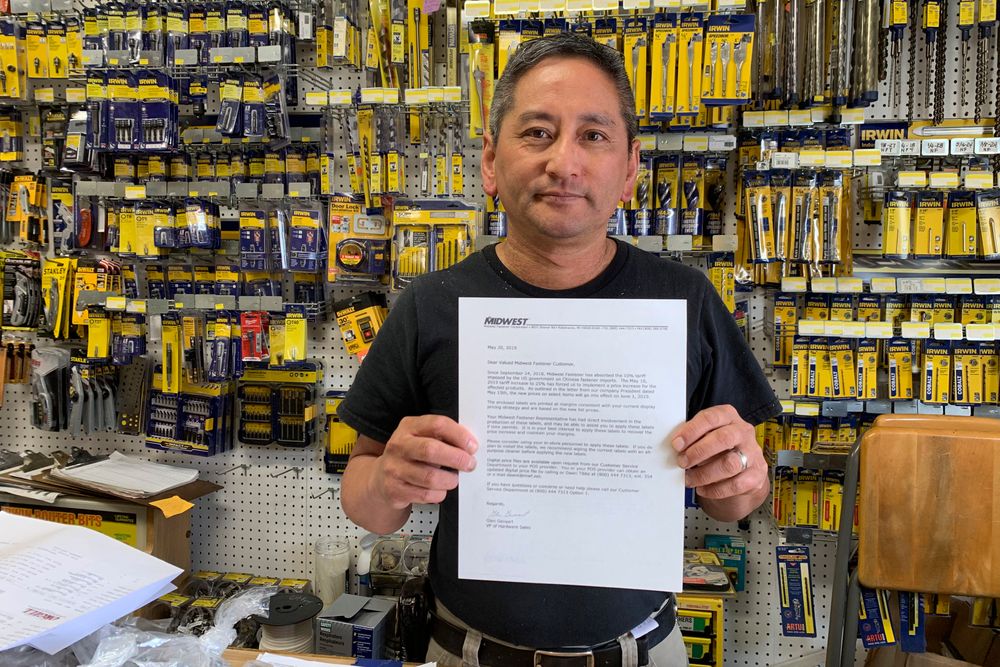 In this photo taken Wednesday, Aug. 28, 2019, Albert Chow, owner of Great Wall Hardware in San Francisco, holds a May 2019 letter from a supplier notifying him that prices will be increasing 10 to 18 percent because of US tariffs on Chinese goods. He says he has no choice but to raise store prices on those products. (AP Photo/Terry Chea) In this photo taken Wednesday, Aug. 28, 2019, Albert Chow, owner of Great Wall Hardware in San Francisco, holds a May 2019 letter from a supplier notifying him that prices will be increasing 10 to 18 percent because of US tariffs on Chinese goods. He says he has no choice but to raise store prices on those products. (AP Photo/Terry Chea)