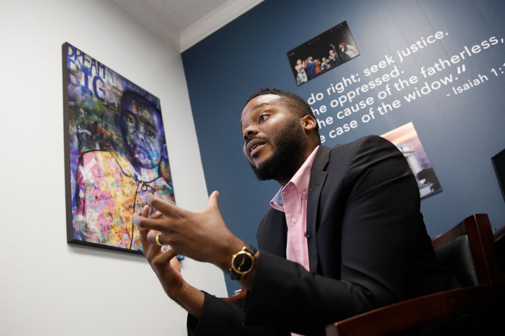 In this photo taken Wednesday Aug. 14, 2019, Stockton Mayor Michael Tubbs discusses a program he initiated to give $500 to 125 people who earn at or below the city's median household income of $46,033 during an interview in Stockton, Calif. They get the money on a debit card on the 15th of each month to spend any what they want. Tubbs says the program, which is privately funded, could be a solution to the city's poverty problem. (AP Photo/Rich Pedroncelli) In this photo taken Wednesday Aug. 14, 2019, Stockton Mayor Michael Tubbs discusses a program he initiated to give $500 to 125 people who earn at or below the city's median household income of $46,033 during an interview in Stockton, Calif. They get the money on a debit card on the 15th of each month to spend any what they want. Tubbs says the program, which is privately funded, could be a solution to the city's poverty problem. (AP Photo/Rich Pedroncelli)