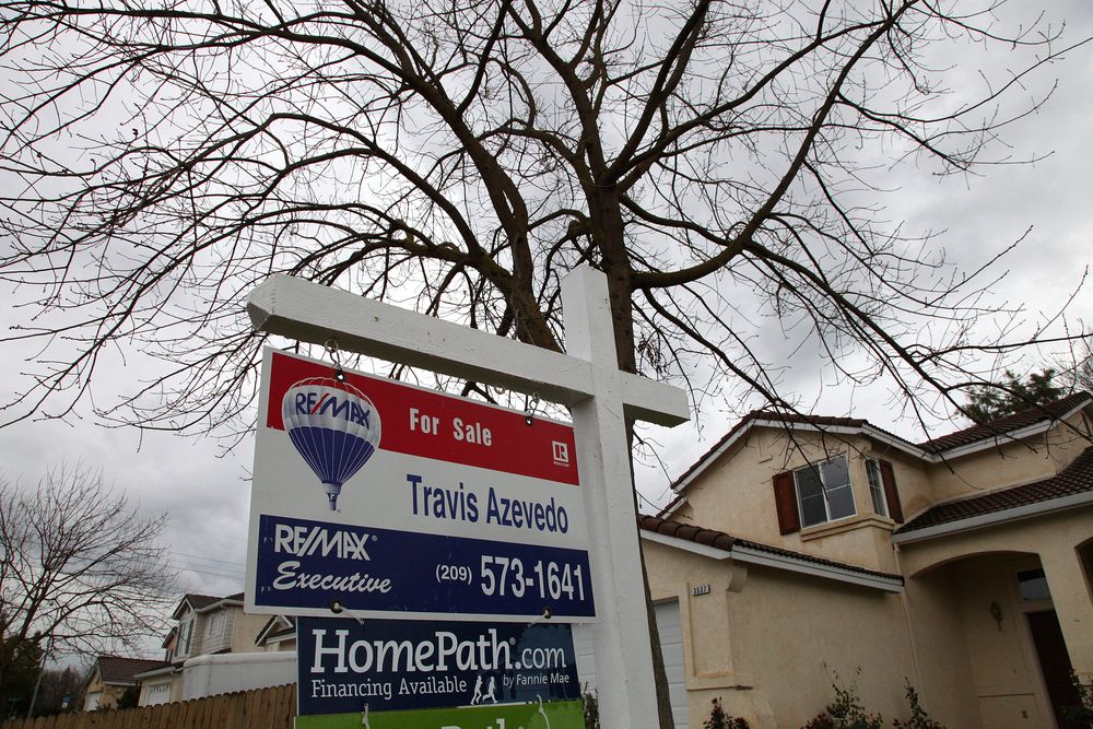 FILE -- In this Feb. 29. 2012 file photo a for sale sign is seen on the lawn of a foreclosed home in Stockton, Calif. Stockton has twice topped Forbes magazine's list of FILE -- In this Feb. 29. 2012 file photo a for sale sign is seen on the lawn of a foreclosed home in Stockton, Calif. Stockton has twice topped Forbes magazine's list of