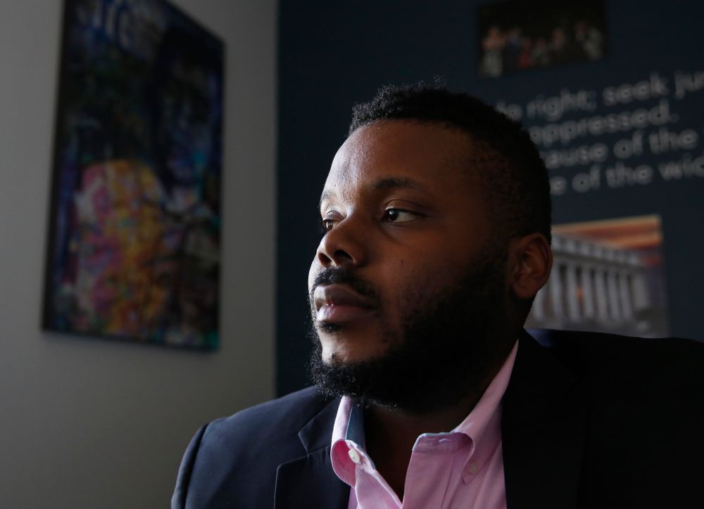 In this photo taken Wednesday Aug. 14, 2019 Stockton Mayor Michael Tubbs initiated a program to give $500 to 125 people who earn at or below the city's median household income of $46,033 during an interview in Stockton, Calif. They get the money on a debit card on the 15th of each month to spend any what they want. Tubbs says the program, which is privately funded, could be a solution to the city's poverty problem. (AP Photo/Rich Pedroncelli) In this photo taken Wednesday Aug. 14, 2019 Stockton Mayor Michael Tubbs initiated a program to give $500 to 125 people who earn at or below the city's median household income of $46,033 during an interview in Stockton, Calif. They get the money on a debit card on the 15th of each month to spend any what they want. Tubbs says the program, which is privately funded, could be a solution to the city's poverty problem. (AP Photo/Rich Pedroncelli)