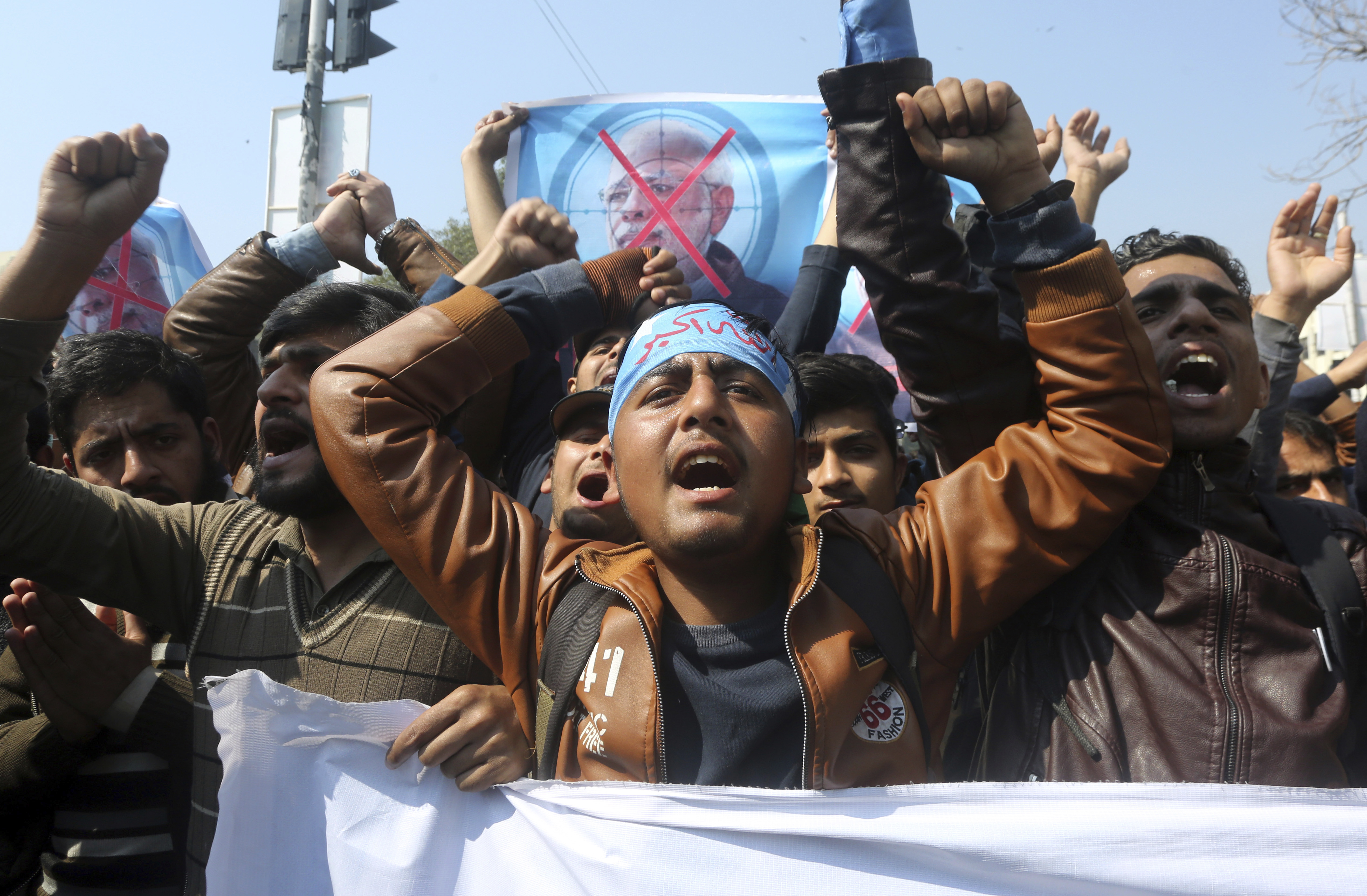Supporters of a Pakistani religious group Islami Jamiat-e-Talaba chant slogans at a rally against India, Wednesday, Feb. 27, 2019. Pakistan's air force shot down two Indian warplanes after they crossed the boundary between the two nuclear-armed rivals in the disputed territory of Kashmir on Wednesday and captured one Indian pilot, a military spokesman said. (AP Photo/K.M. Chaudary) Supporters of a Pakistani religious group Islami Jamiat-e-Talaba chant slogans at a rally against India, Wednesday, Feb. 27, 2019. Pakistan's air force shot down two Indian warplanes after they crossed the boundary between the two nuclear-armed rivals in the disputed territory of Kashmir on Wednesday and captured one Indian pilot, a military spokesman said. (AP Photo/K.M. Chaudary)