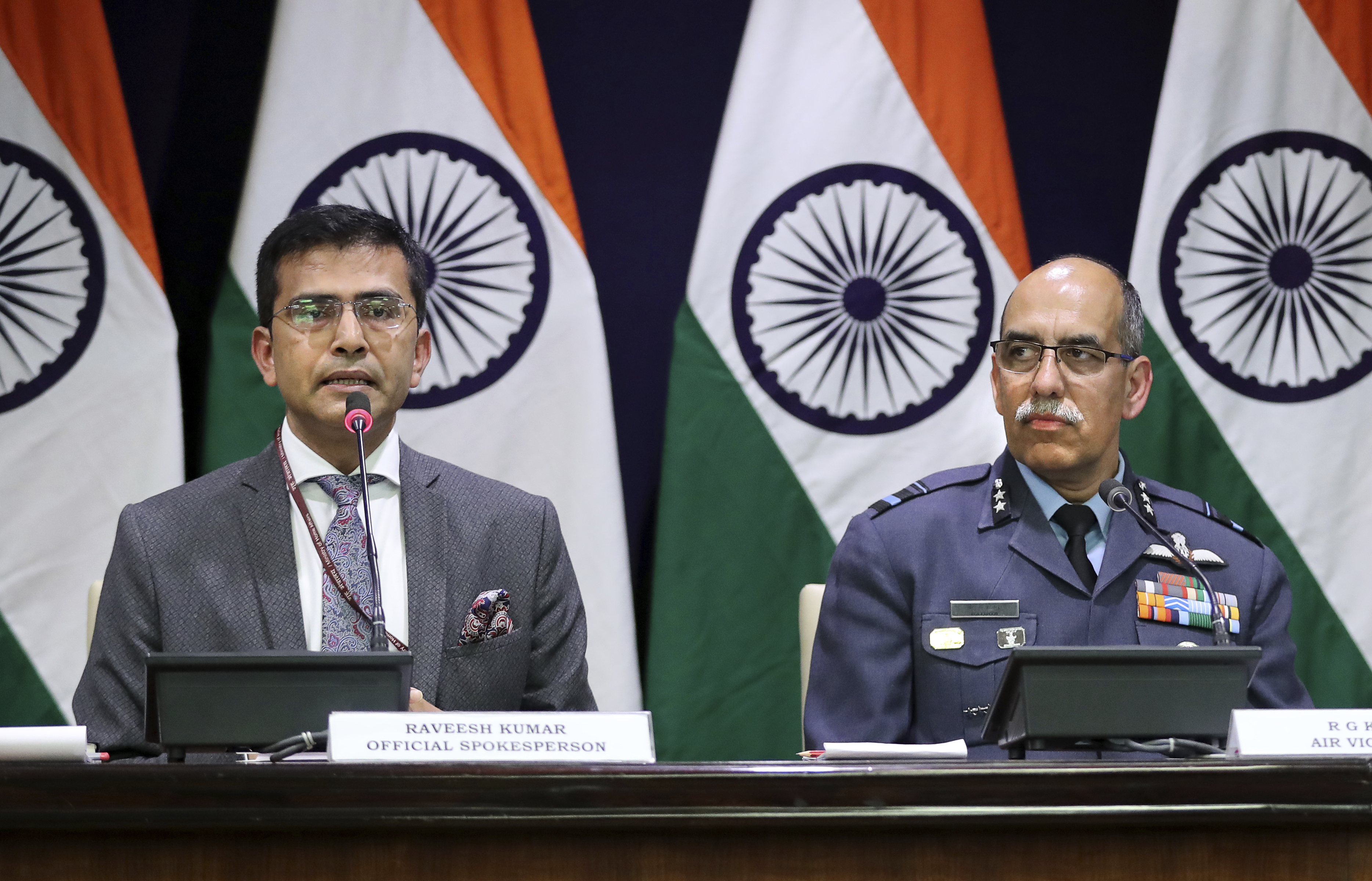 Indian Foreign Ministry spokesperson Raveesh Kumar, left, with Indian Air Force Air Vice Marshal R.G.K. Kapoor gives a statement in New Delhi, India, Wednesday, Feb. 27, 2019. Pakistan's air force shot down two Indian warplanes after they crossed the boundary between the two nuclear-armed rivals in the disputed territory of Kashmir on Wednesday and captured two Indian pilots, one of whom was injured, a Pakistani military spokesman said. Kumar said one of its Mig-21 fighter aircraft was missing and that India was still Indian Foreign Ministry spokesperson Raveesh Kumar, left, with Indian Air Force Air Vice Marshal R.G.K. Kapoor gives a statement in New Delhi, India, Wednesday, Feb. 27, 2019. Pakistan's air force shot down two Indian warplanes after they crossed the boundary between the two nuclear-armed rivals in the disputed territory of Kashmir on Wednesday and captured two Indian pilots, one of whom was injured, a Pakistani military spokesman said. Kumar said one of its Mig-21 fighter aircraft was missing and that India was still
