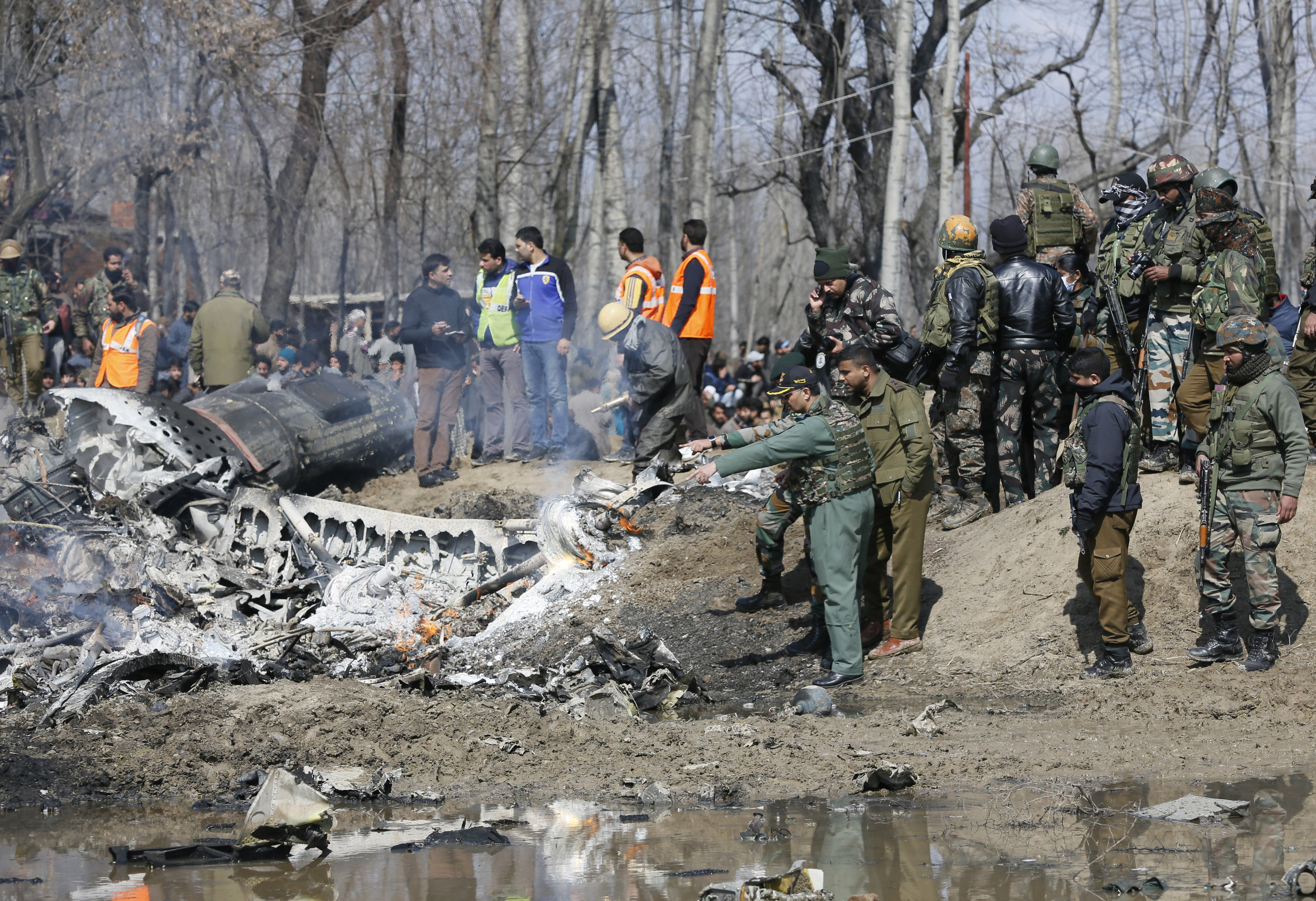 An Indian Air Force officer along with others inspects the wreckage of an Indian aircraft after it crashed in Budgam area, outskirts of Srinagar, Indian controlled Kashmir, Wednesday, Feb.27, 2019. (AP Photo/Mukhtar Khan) An Indian Air Force officer along with others inspects the wreckage of an Indian aircraft after it crashed in Budgam area, outskirts of Srinagar, Indian controlled Kashmir, Wednesday, Feb.27, 2019. (AP Photo/Mukhtar Khan)