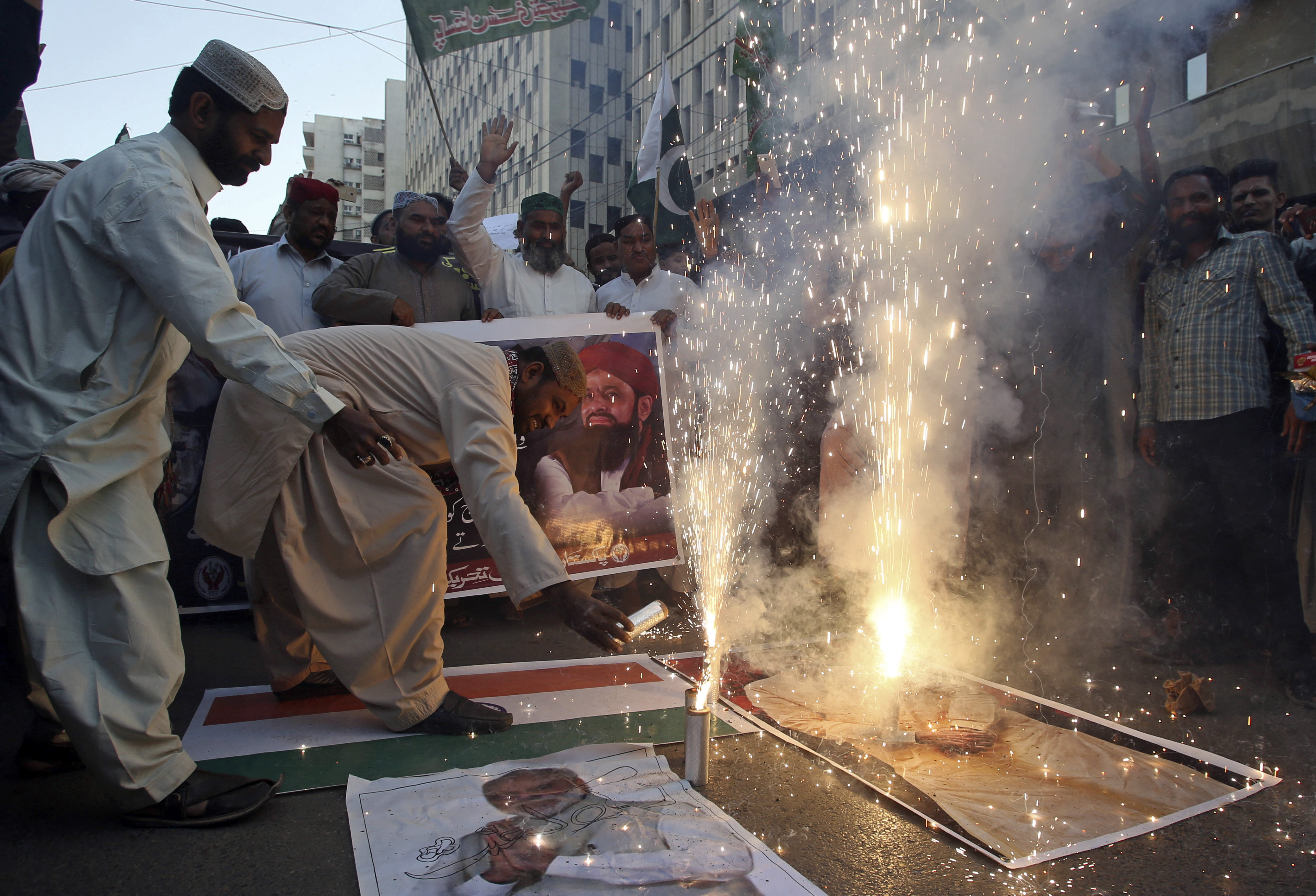 People celebrate the shooting down of Indian planes by Pakistani forces with fireworks, in Karachi, Pakistan, Wednesday, Feb. 27, 2019. Pakistan's military said Wednesday it shot down two Indian warplanes in the disputed region of Kashmir and captured two pilots, raising tensions between the nuclear-armed rivals to a level unseen in 20 years. (AP Photo/Fareed Khan) People celebrate the shooting down of Indian planes by Pakistani forces with fireworks, in Karachi, Pakistan, Wednesday, Feb. 27, 2019. Pakistan's military said Wednesday it shot down two Indian warplanes in the disputed region of Kashmir and captured two pilots, raising tensions between the nuclear-armed rivals to a level unseen in 20 years. (AP Photo/Fareed Khan)