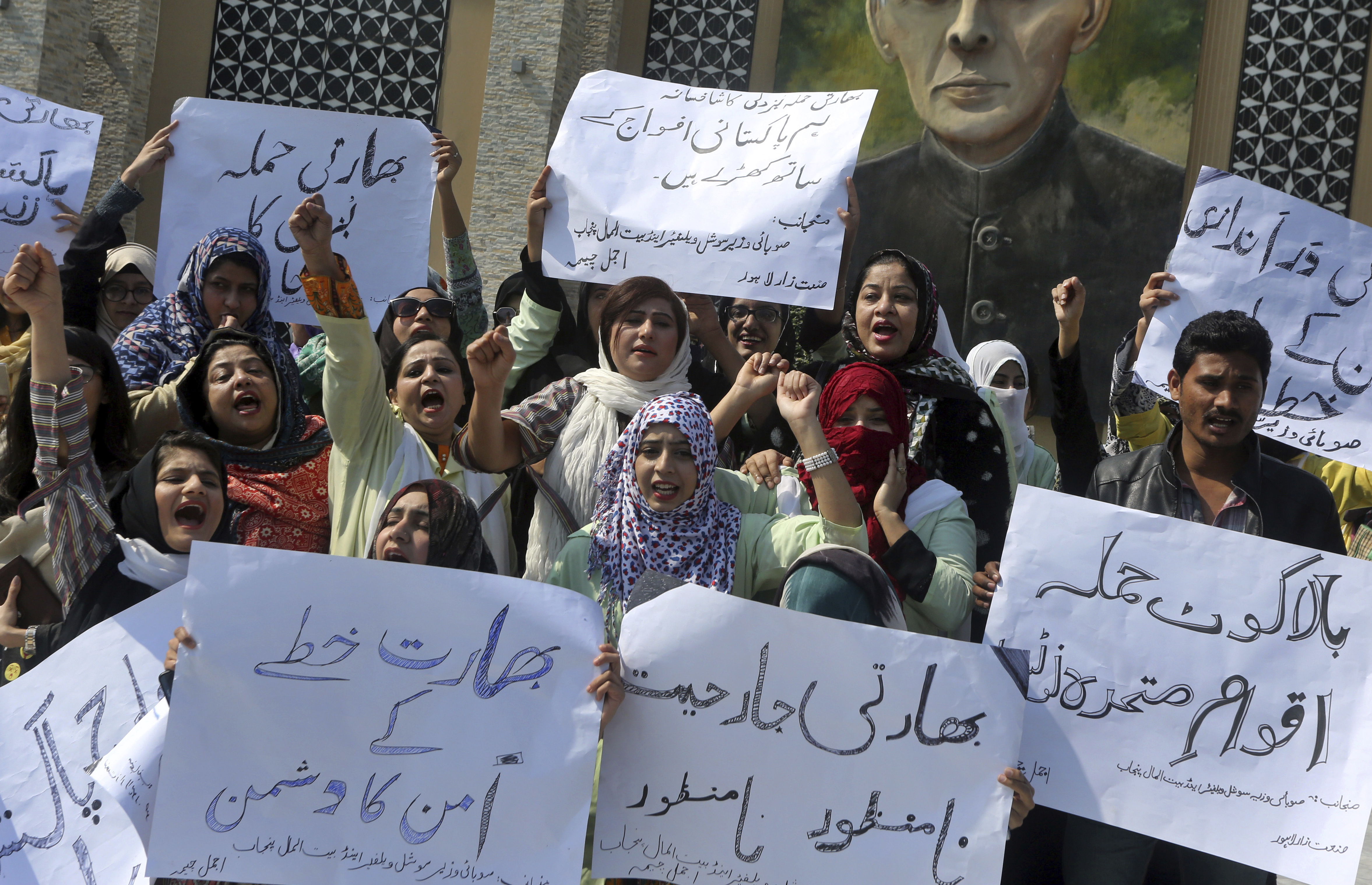 Supporters of a Pakistani religious group Islami Jamiat-e-Talaba chant slogans at a rally against India, Wednesday, Feb. 27, 2019. Pakistan's air force shot down two Indian warplanes after they crossed the boundary between the two nuclear-armed rivals in the disputed territory of Kashmir on Wednesday and captured one Indian pilot, a military spokesman said. Banners read: Supporters of a Pakistani religious group Islami Jamiat-e-Talaba chant slogans at a rally against India, Wednesday, Feb. 27, 2019. Pakistan's air force shot down two Indian warplanes after they crossed the boundary between the two nuclear-armed rivals in the disputed territory of Kashmir on Wednesday and captured one Indian pilot, a military spokesman said. Banners read: