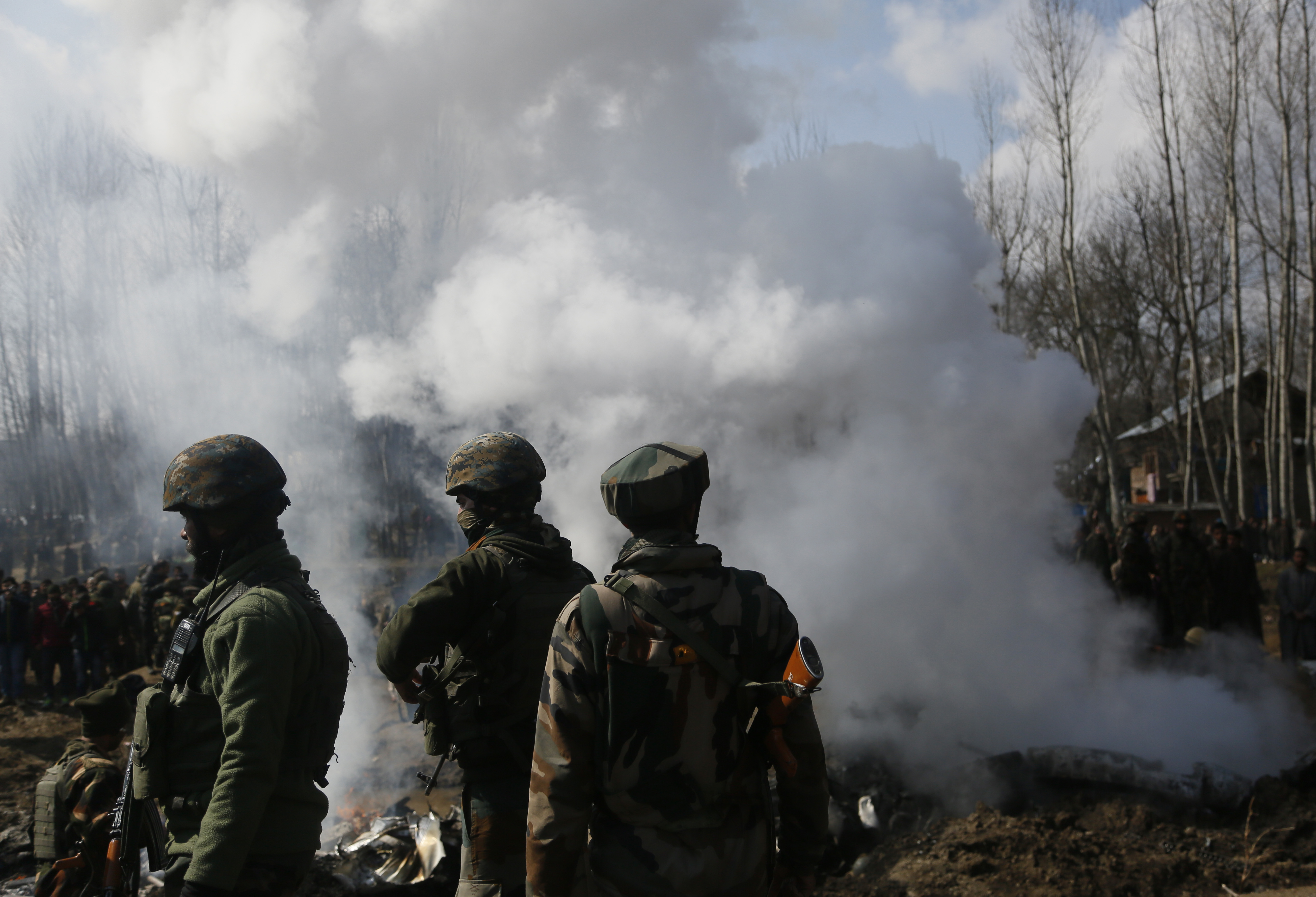 Indian army soldiers stand near the wreckage of an Indian aircraft after it crashed in Budgam area, outskirts of Srinagar, Indian controlled Kashmir, Wednesday, Feb.27, 2019. (AP Photo/Mukhtar Khan) Indian army soldiers stand near the wreckage of an Indian aircraft after it crashed in Budgam area, outskirts of Srinagar, Indian controlled Kashmir, Wednesday, Feb.27, 2019. (AP Photo/Mukhtar Khan)