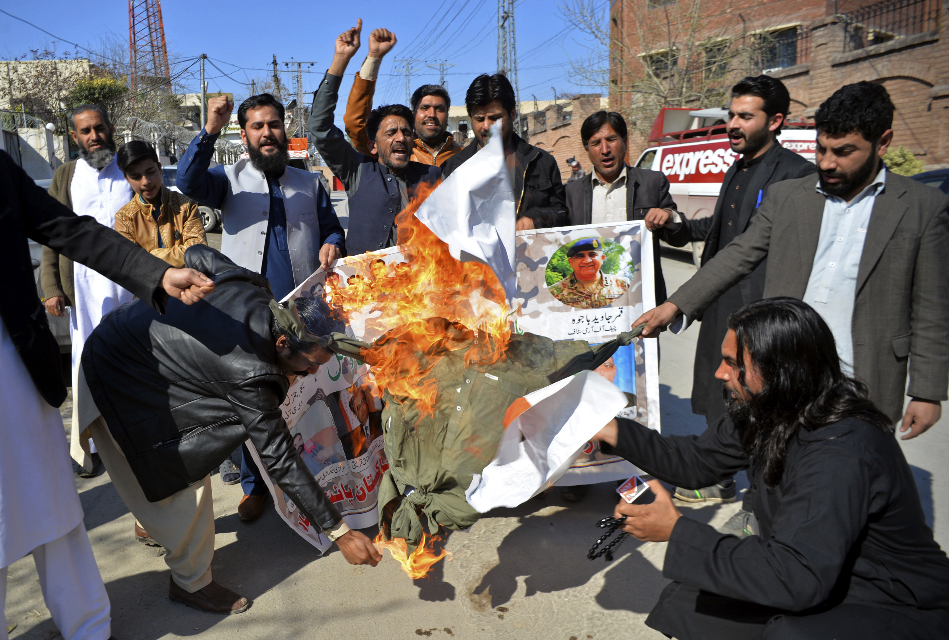 Pakistani protesters burn an effigy of Indian Prime Minister Narendra Modi during a rally in Peshawar, Pakistan, Wednesday, Feb. 27, 2019. Pakistan's military said Wednesday it shot down two Indian warplanes in the disputed region of Kashmir and captured two pilots, raising tensions between the nuclear-armed rivals to a level unseen in 20 years. (AP Photo/Muhammad Sajjad) Pakistani protesters burn an effigy of Indian Prime Minister Narendra Modi during a rally in Peshawar, Pakistan, Wednesday, Feb. 27, 2019. Pakistan's military said Wednesday it shot down two Indian warplanes in the disputed region of Kashmir and captured two pilots, raising tensions between the nuclear-armed rivals to a level unseen in 20 years. (AP Photo/Muhammad Sajjad)