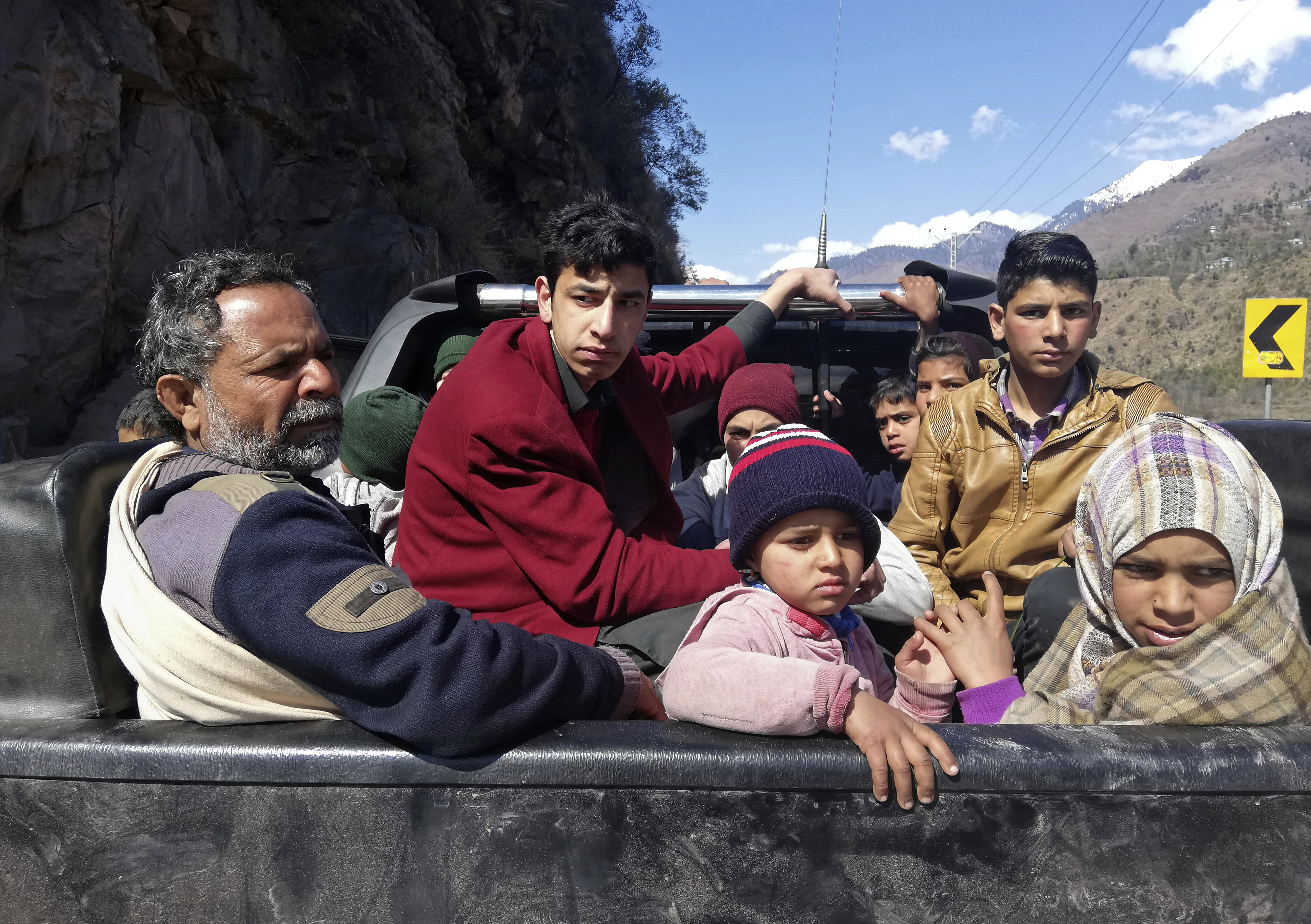 Pakistani Kashmiris flee the town of Chakoti which is about 3 miles, 5 km, from the Pakistan Indian border, following the intense exchange of fire between Pakistan and India, at the Line of Control in Pakistani Kashmir, Wednesday, Feb. 27, 2019. Pakistan's military said Wednesday it shot down two Indian warplanes in the disputed region of Kashmir and captured two pilots, raising tensions between the nuclear-armed rivals to a level unseen in 20 years. (AP Photo/M.D. Mughal) Pakistani Kashmiris flee the town of Chakoti which is about 3 miles, 5 km, from the Pakistan Indian border, following the intense exchange of fire between Pakistan and India, at the Line of Control in Pakistani Kashmir, Wednesday, Feb. 27, 2019. Pakistan's military said Wednesday it shot down two Indian warplanes in the disputed region of Kashmir and captured two pilots, raising tensions between the nuclear-armed rivals to a level unseen in 20 years. (AP Photo/M.D. Mughal)