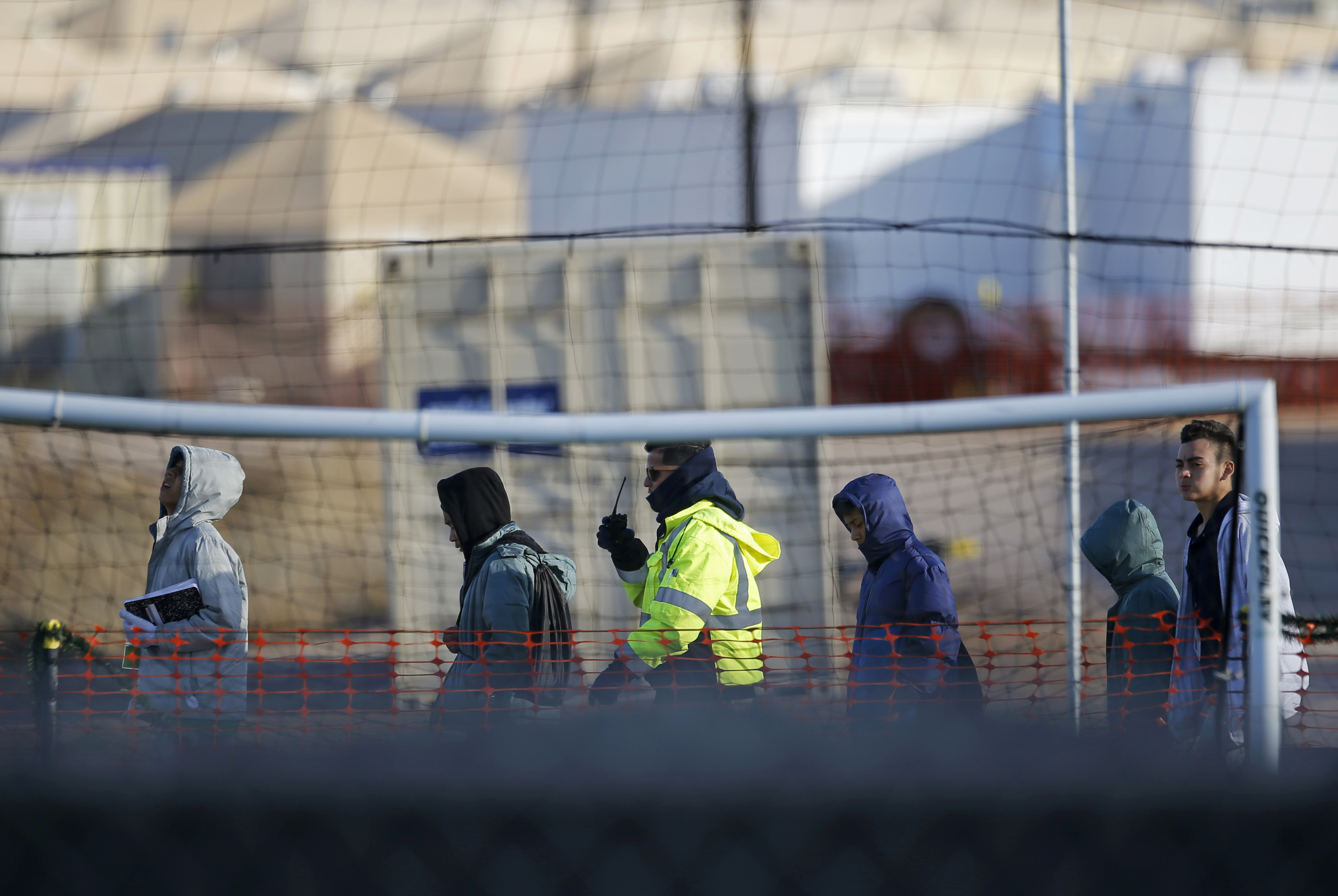 File - In this Dec. 13, 2018, file photo, teen migrants walk in line inside the Tornillo detention camp in Tornillo, Texas. A federal judge says he will give the Trump administration six months to identify children who were separated from their families at the U.S.-Mexico border early in the president's term. U.S. District Judge Dana Sabraw said Thursday, April 25, 2019, in San Diego that it was important to set a deadline for finding potentially thousands of children who were separated between July 1, 2017, and June 25, 2018. (AP Photo/Andres Leighton, File) File - In this Dec. 13, 2018, file photo, teen migrants walk in line inside the Tornillo detention camp in Tornillo, Texas. A federal judge says he will give the Trump administration six months to identify children who were separated from their families at the U.S.-Mexico border early in the president's term. U.S. District Judge Dana Sabraw said Thursday, April 25, 2019, in San Diego that it was important to set a deadline for finding potentially thousands of children who were separated between July 1, 2017, and June 25, 2018. (AP Photo/Andres Leighton, File)