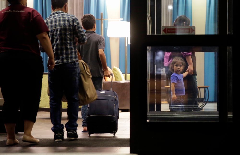 In this Monday, July 23, 2018, file photo, immigrants seeking asylum who were recently reunited arrive at a hotel, in San Antonio. A federal judge says he will give the Trump administration six months to identify children who were separated from their families at the U.S.-Mexico border early in the president's term. U.S. District Judge Dana Sabraw said Thursday, April 25, 2019, in San Diego that it was important to set a deadline for finding potentially thousands of children who were separated between July 1, 2017, and June 25, 2018. (AP Photo/Eric Gay, File) In this Monday, July 23, 2018, file photo, immigrants seeking asylum who were recently reunited arrive at a hotel, in San Antonio. A federal judge says he will give the Trump administration six months to identify children who were separated from their families at the U.S.-Mexico border early in the president's term. U.S. District Judge Dana Sabraw said Thursday, April 25, 2019, in San Diego that it was important to set a deadline for finding potentially thousands of children who were separated between July 1, 2017, and June 25, 2018. (AP Photo/Eric Gay, File)