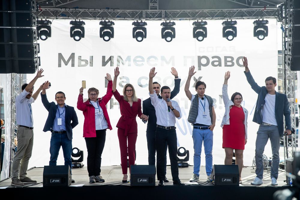 Russian opposition candidate and lawyer at the Foundation for Fighting Corruption Lyubov Sobol, center left, and candidate Ivan Zhdanov, center right, with other candidates wave to the crowd during a protest in Moscow, Russia, Saturday, July 20, 2019. Masses of people gathered in central Moscow to demand that opposition candidates be included on ballots for an upcoming city parliament election in September. (AP Photo/Pavel Golovkin) Russian opposition candidate and lawyer at the Foundation for Fighting Corruption Lyubov Sobol, center left, and candidate Ivan Zhdanov, center right, with other candidates wave to the crowd during a protest in Moscow, Russia, Saturday, July 20, 2019. Masses of people gathered in central Moscow to demand that opposition candidates be included on ballots for an upcoming city parliament election in September. (AP Photo/Pavel Golovkin)