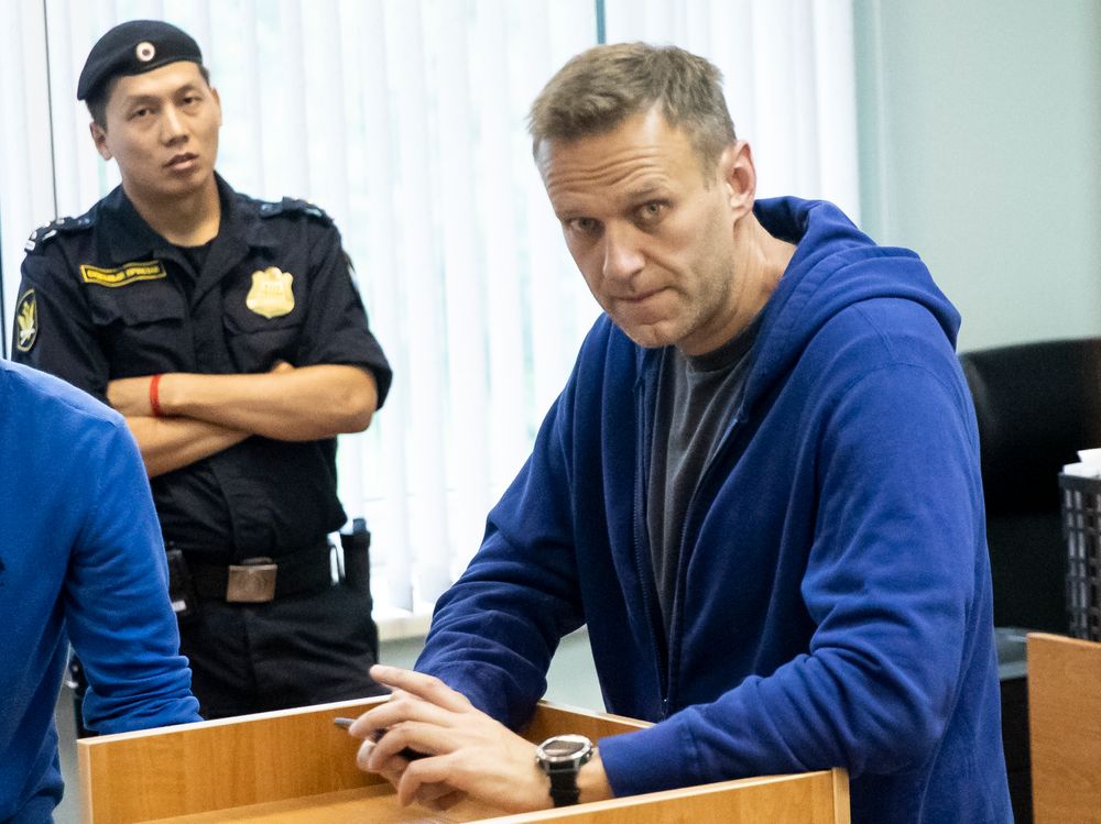 Alexei Navalny, Russia's most prominent opposition figure, who has been detained by police and charged with unlawfully organizing a public gathering, sits in a court room in Moscow, Russia, Wednesday, July 24, 2019. Navalny has called for demonstrators to protest on Saturday outside the mayor's office against the rejection of several opposition candidates from the ballot for the Moscow city council elections. (AP Photo/Pavel Golovkin) Alexei Navalny, Russia's most prominent opposition figure, who has been detained by police and charged with unlawfully organizing a public gathering, sits in a court room in Moscow, Russia, Wednesday, July 24, 2019. Navalny has called for demonstrators to protest on Saturday outside the mayor's office against the rejection of several opposition candidates from the ballot for the Moscow city council elections. (AP Photo/Pavel Golovkin)