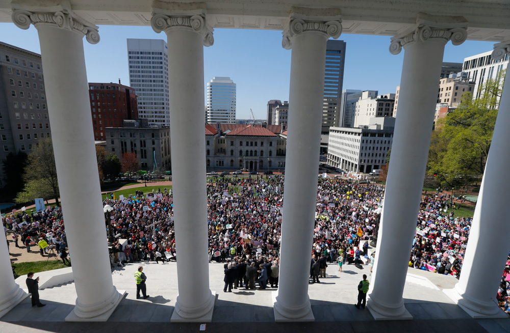 FILE - In this April 3, 2019, file photo, Right to Life marchers gather on the steps of the Capitol to listen to speakers in Richmond, Va. As abortion opponents cheer the passage of fetal heartbeat laws and other restrictions on the procedure, abortion-rights groups have been waging a quieter battle in courthouses around the country to overturn limits on providers. The first case to make it to trial is a lawsuit challenging abortion laws in Virginia. (AP Photo/Steve Helber, File) FILE - In this April 3, 2019, file photo, Right to Life marchers gather on the steps of the Capitol to listen to speakers in Richmond, Va. As abortion opponents cheer the passage of fetal heartbeat laws and other restrictions on the procedure, abortion-rights groups have been waging a quieter battle in courthouses around the country to overturn limits on providers. The first case to make it to trial is a lawsuit challenging abortion laws in Virginia. (AP Photo/Steve Helber, File)