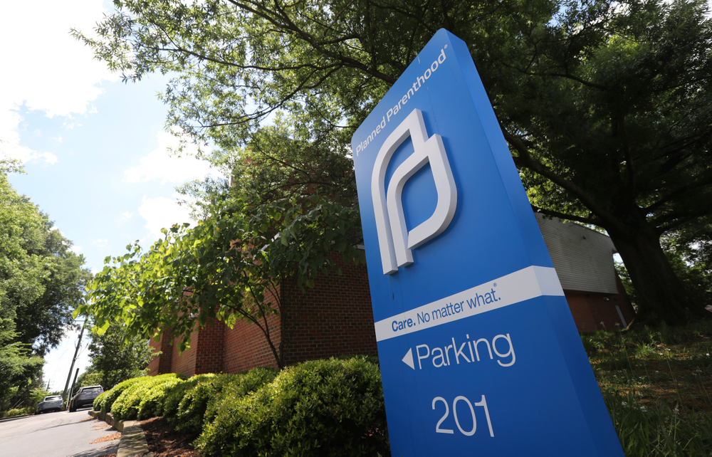 FILE - This May 15, 2019, file photo shows a sign in front of the Planned Parenthood offices in Richmond, Va. At least a dozen lawsuits have been filed over the last two years challenging what abortion-rights groups call targeted restrictions on abortion providers. Planned Parenthood is challenging physician-only laws in Virginia, Maine, Wisconsin, Idaho and Arizona. (AP Photo/Steve Helber, File) FILE - This May 15, 2019, file photo shows a sign in front of the Planned Parenthood offices in Richmond, Va. At least a dozen lawsuits have been filed over the last two years challenging what abortion-rights groups call targeted restrictions on abortion providers. Planned Parenthood is challenging physician-only laws in Virginia, Maine, Wisconsin, Idaho and Arizona. (AP Photo/Steve Helber, File)