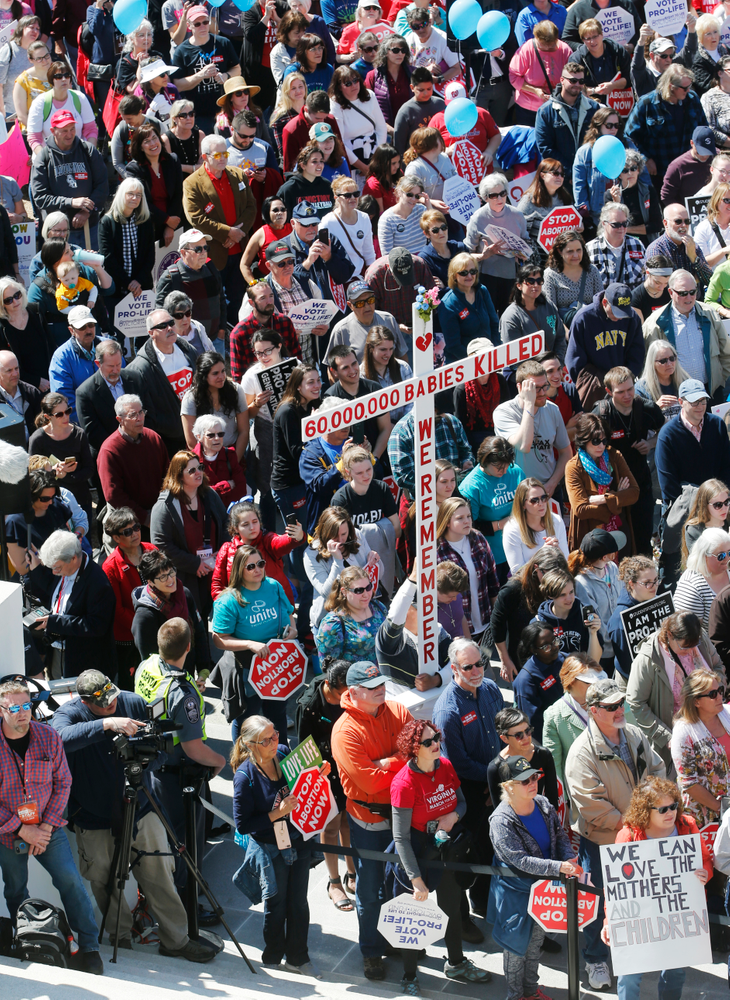 FILE - In this April 3, 2019, file photo, Right to Life marchers gather on the steps of the Capitol to listen to speakers in Richmond, Va. As abortion opponents cheer the passage of fetal heartbeat laws and other restrictions on the procedure, abortion-rights groups have been waging a quieter battle in courthouses around the country to overturn limits on providers. The first case to make it to trial is a lawsuit challenging abortion laws in Virginia. (AP Photo/Steve Helber, File) FILE - In this April 3, 2019, file photo, Right to Life marchers gather on the steps of the Capitol to listen to speakers in Richmond, Va. As abortion opponents cheer the passage of fetal heartbeat laws and other restrictions on the procedure, abortion-rights groups have been waging a quieter battle in courthouses around the country to overturn limits on providers. The first case to make it to trial is a lawsuit challenging abortion laws in Virginia. (AP Photo/Steve Helber, File)