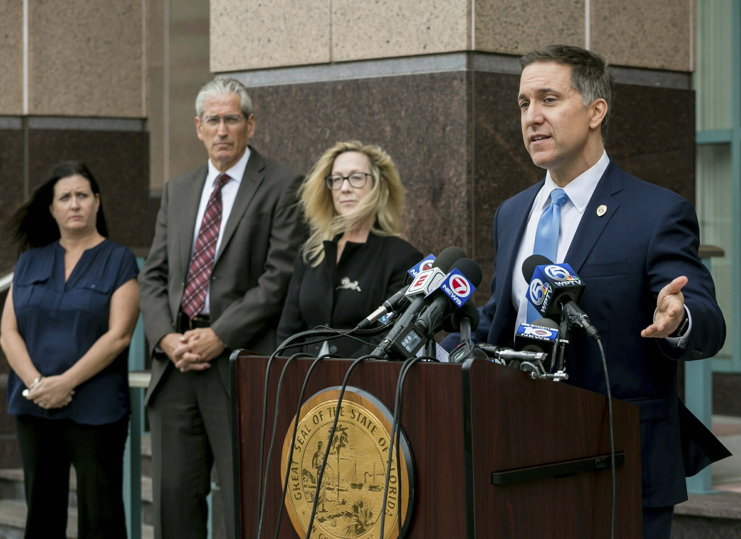 Palm Beach County State Attorney Dave Aronberg speaks to the media with assistants, from left to right, Judy Arco, Al Johnson, and Elizabeth Neto, about charges in recent prostitution investigations outside his offices Monday, Feb. 25, 2019 in West Palm Beach, Fla. New England Patriots owner Robert Kraft visited a Florida massage parlor for sex acts the night before and the morning of last month's AFC Championship Game, which he attended in Kansas City, authorities said in documents charging him with two misdemeanor counts of soliciting prostitution. (Richard Graulich/Palm Beach Post via AP) Palm Beach County State Attorney Dave Aronberg speaks to the media with assistants, from left to right, Judy Arco, Al Johnson, and Elizabeth Neto, about charges in recent prostitution investigations outside his offices Monday, Feb. 25, 2019 in West Palm Beach, Fla. New England Patriots owner Robert Kraft visited a Florida massage parlor for sex acts the night before and the morning of last month's AFC Championship Game, which he attended in Kansas City, authorities said in documents charging him with two misdemeanor counts of soliciting prostitution. (Richard Graulich/Palm Beach Post via AP)