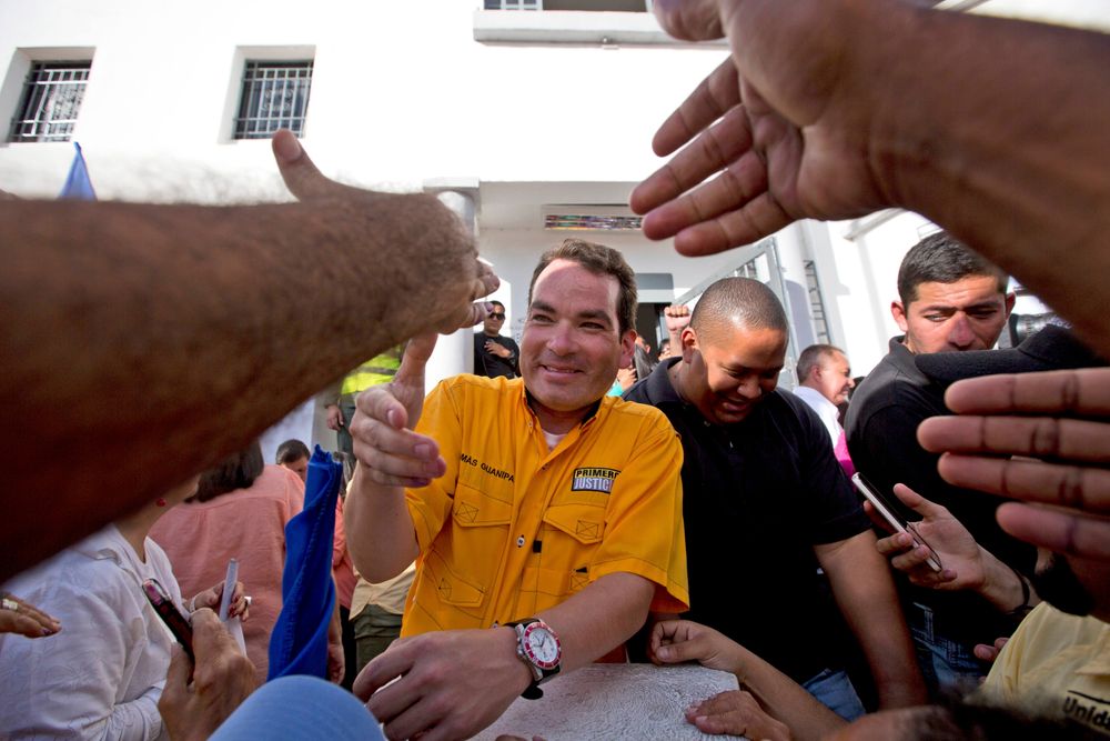 FILE - In this Dec. 9, 2015 file photo, reelected opposition congressman Tomas Guanipa greets supporters outside the National Electoral Council in Caracas, Venezuela. On Monday, Aug. 12, 2019, Venezuela’s supreme court stripped Guanipa and two other opposition lawmakers of immunity from prosecution as accused traitors amid rising political tension in the crisis-stricken nation. (AP Photo/Fernando Llano, File) FILE - In this Dec. 9, 2015 file photo, reelected opposition congressman Tomas Guanipa greets supporters outside the National Electoral Council in Caracas, Venezuela. On Monday, Aug. 12, 2019, Venezuela’s supreme court stripped Guanipa and two other opposition lawmakers of immunity from prosecution as accused traitors amid rising political tension in the crisis-stricken nation. (AP Photo/Fernando Llano, File)