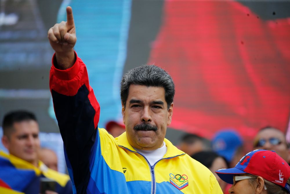 Venezuela's President Nicolas Maduro and first lady Cilia Flores, right, lead a rally condemning the economic sanctions imposed by the administration of U.S. President Donald Trump on Venezuela, in Caracas, Venezuela, Saturday, Aug. 10, 2019. Supporters of Maduro joined him after he called for protests against the recent moves by the U.S. to tighten sanctions against the ruling authorities. (AP Photo/Ariana Cubillos) Venezuela's President Nicolas Maduro and first lady Cilia Flores, right, lead a rally condemning the economic sanctions imposed by the administration of U.S. President Donald Trump on Venezuela, in Caracas, Venezuela, Saturday, Aug. 10, 2019. Supporters of Maduro joined him after he called for protests against the recent moves by the U.S. to tighten sanctions against the ruling authorities. (AP Photo/Ariana Cubillos)