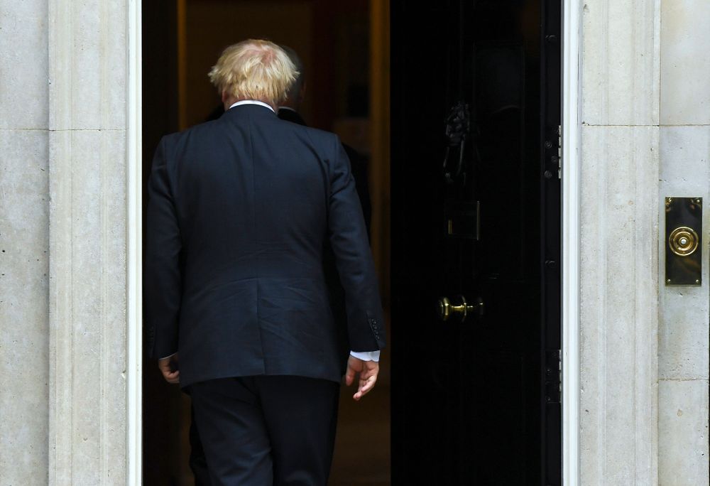 Britain's Prime Minister Boris Johnson walks back into 10 Downing Street after greeting US Vice President Mike Pence in London, Thursday, Sept. 5, 2019. (AP Photo/Alberto Pezzali) Britain's Prime Minister Boris Johnson walks back into 10 Downing Street after greeting US Vice President Mike Pence in London, Thursday, Sept. 5, 2019. (AP Photo/Alberto Pezzali)
