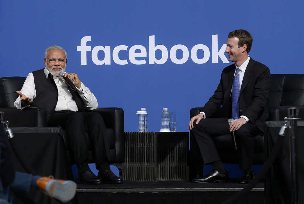 FILE - In this Sept. 27, 2015, file photo, Prime Minister of India Narendra Modi, left, speaks seated next to Facebook CEO Mark Zuckerberg at Facebook in Menlo Park, Calif. Modi, 68, the leader of the Hindu nationalist Bharatiya Janata Party, has carefully constructed an image of himself as a pious man of the people, a would-be monk called to politics who has elevated India’s status globally and transformed its parliamentary elections from a contest of political parties on social and economic issues into a cult of personality. The cult has been fueled by a social media blitzkrieg. There was NaMo TV and a NaMo app. Like President Donald Trump, to whom he is often compared, Modi is a big fan of Twitter, using it and a YouTube channel managed by the BJP to bypass traditional media. (AP Photo/Jeff Chiu, File) FILE - In this Sept. 27, 2015, file photo, Prime Minister of India Narendra Modi, left, speaks seated next to Facebook CEO Mark Zuckerberg at Facebook in Menlo Park, Calif. Modi, 68, the leader of the Hindu nationalist Bharatiya Janata Party, has carefully constructed an image of himself as a pious man of the people, a would-be monk called to politics who has elevated India’s status globally and transformed its parliamentary elections from a contest of political parties on social and economic issues into a cult of personality. The cult has been fueled by a social media blitzkrieg. There was NaMo TV and a NaMo app. Like President Donald Trump, to whom he is often compared, Modi is a big fan of Twitter, using it and a YouTube channel managed by the BJP to bypass traditional media. (AP Photo/Jeff Chiu, File)