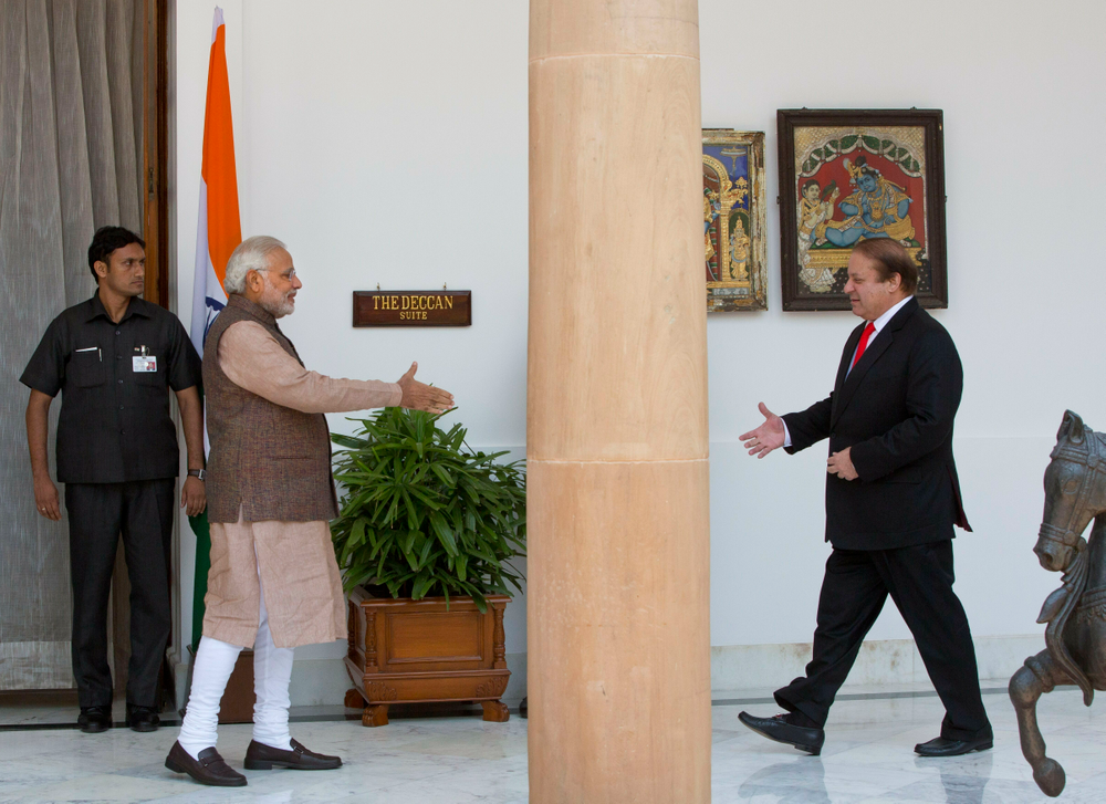 FILE - In this May 27, 2014 file photo, Indian Prime Minister Narendra Modi, left, walks to shake hand with his Pakistani counterpart Nawaz Sharif before the start of their meeting in New Delhi, India. Indian Prime Minister Narendra Modi's party claimed it had won re-election with a commanding lead in vote count Thursday, May 23, 2019. When India retaliated after a suicide bombing in Kashmir with an airstrike of an alleged militant training camp inside Pakistan, Modi started referring to himself as India’s “chowkidar,” or watchman, adding it as a prefix to his official Twitter account. Party leaders and a number of his 47.3 million Twitter followers quickly followed suit. (AP Photo/Manish Swarup, File) FILE - In this May 27, 2014 file photo, Indian Prime Minister Narendra Modi, left, walks to shake hand with his Pakistani counterpart Nawaz Sharif before the start of their meeting in New Delhi, India. Indian Prime Minister Narendra Modi's party claimed it had won re-election with a commanding lead in vote count Thursday, May 23, 2019. When India retaliated after a suicide bombing in Kashmir with an airstrike of an alleged militant training camp inside Pakistan, Modi started referring to himself as India’s “chowkidar,” or watchman, adding it as a prefix to his official Twitter account. Party leaders and a number of his 47.3 million Twitter followers quickly followed suit. (AP Photo/Manish Swarup, File)