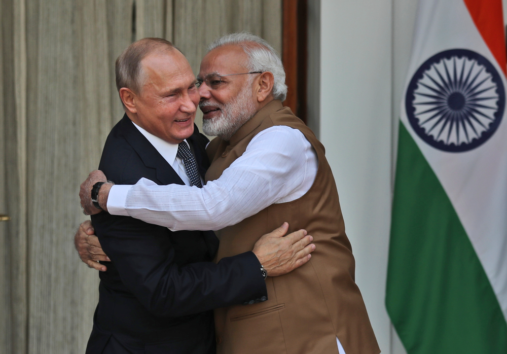 FILE - In this Oct. 5, 2018 file photo, Indian Prime Minister Narendra Modi, right, hugs Russian President Vladimir Putin before their meeting in New Delhi, India. Indian Prime Minister Narendra Modi's party claimed it had won re-election with a commanding lead in vote count Thursday, May 23, 2019. Modi, 68, the leader of the Hindu nationalist Bharatiya Janata Party, has carefully constructed an image of himself as a pious man of the people, a would-be monk called to politics who has elevated India’s status globally and transformed its parliamentary elections from a contest of political parties on social and economic issues into a cult of personality. (AP Photo/Manish Swarup, File) FILE - In this Oct. 5, 2018 file photo, Indian Prime Minister Narendra Modi, right, hugs Russian President Vladimir Putin before their meeting in New Delhi, India. Indian Prime Minister Narendra Modi's party claimed it had won re-election with a commanding lead in vote count Thursday, May 23, 2019. Modi, 68, the leader of the Hindu nationalist Bharatiya Janata Party, has carefully constructed an image of himself as a pious man of the people, a would-be monk called to politics who has elevated India’s status globally and transformed its parliamentary elections from a contest of political parties on social and economic issues into a cult of personality. (AP Photo/Manish Swarup, File)
