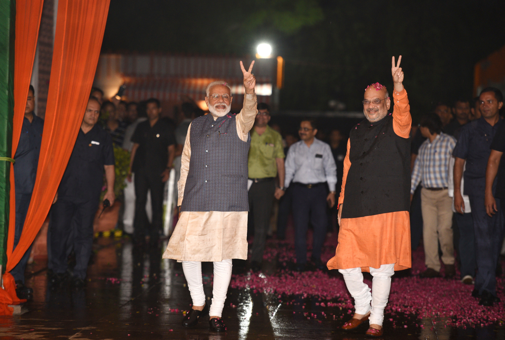 Indian Prime Minister Narendra Modi and Bharatiya Janata Party (BJP) President Amit Shah display the victory symbol to supporters on arrival at the party headquarters in New Delhi, India, Thursday, May 23, 2019. Modi's Hindu nationalist party claimed it won reelection with a commanding lead in Thursday's vote count, while the head of the main opposition party conceded a personal defeat that signaled the end of an era for modern India's main political dynasty. (AP Photo) Indian Prime Minister Narendra Modi and Bharatiya Janata Party (BJP) President Amit Shah display the victory symbol to supporters on arrival at the party headquarters in New Delhi, India, Thursday, May 23, 2019. Modi's Hindu nationalist party claimed it won reelection with a commanding lead in Thursday's vote count, while the head of the main opposition party conceded a personal defeat that signaled the end of an era for modern India's main political dynasty. (AP Photo)