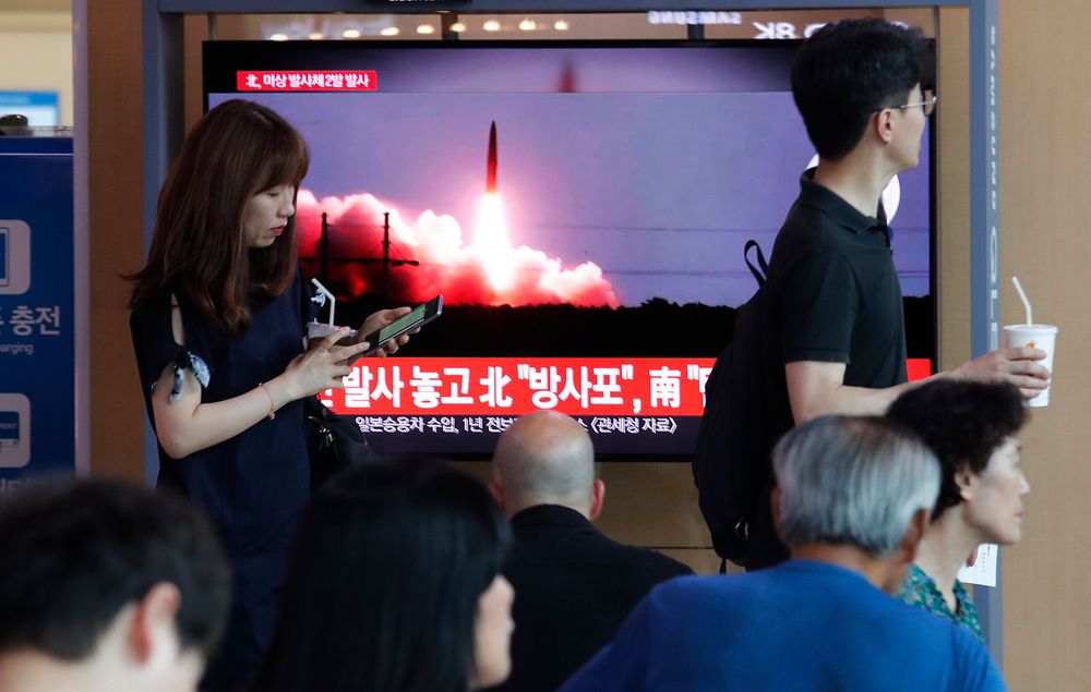 People watch a TV showing a file image of North Korea's missile launch during a news program at the Seoul Railway Station in Seoul, South Korea, Tuesday, Aug. 6, 2019. North Korea on Tuesday continued to ramp up its weapons demonstrations by firing unidentified projectiles twice into the sea while lashing out at the United States and South Korea for continuing their joint military exercises that the North says could derail fragile nuclear diplomacy. The sign reads People watch a TV showing a file image of North Korea's missile launch during a news program at the Seoul Railway Station in Seoul, South Korea, Tuesday, Aug. 6, 2019. North Korea on Tuesday continued to ramp up its weapons demonstrations by firing unidentified projectiles twice into the sea while lashing out at the United States and South Korea for continuing their joint military exercises that the North says could derail fragile nuclear diplomacy. The sign reads