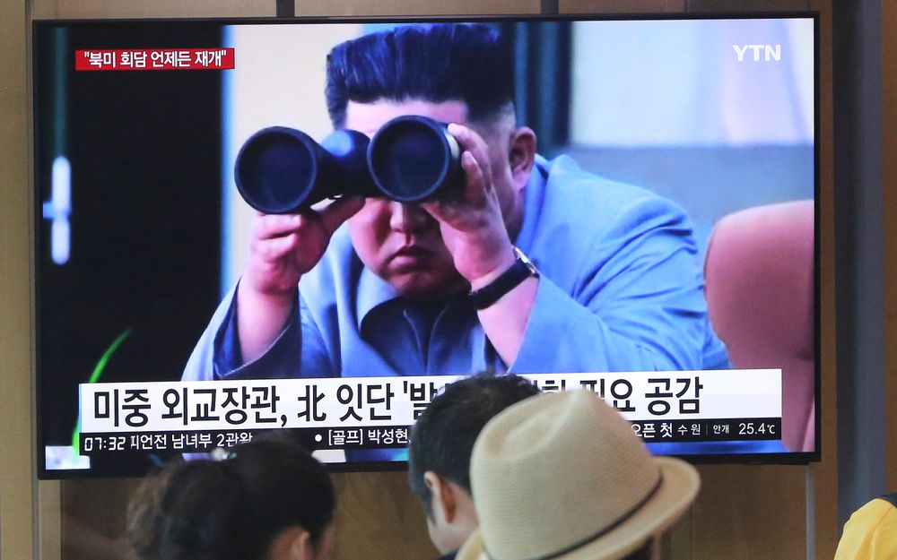FILE - In this Aug. 2, 2019, file photo, people stand by a TV screen showing a file footage of North Korean leader Kim Jong Un during a news program at the Seoul Railway Station in Seoul, South Korea. North Korea on Tuesday, Aug. 6, continued to ramp up its weapons demonstrations by firing unidentified projectiles twice into the sea while lashing out at the United States and South Korea for continuing their joint military exercises that the North says could derail fragile nuclear diplomacy. (AP Photo/Ahn Young-joon, File) FILE - In this Aug. 2, 2019, file photo, people stand by a TV screen showing a file footage of North Korean leader Kim Jong Un during a news program at the Seoul Railway Station in Seoul, South Korea. North Korea on Tuesday, Aug. 6, continued to ramp up its weapons demonstrations by firing unidentified projectiles twice into the sea while lashing out at the United States and South Korea for continuing their joint military exercises that the North says could derail fragile nuclear diplomacy. (AP Photo/Ahn Young-joon, File)