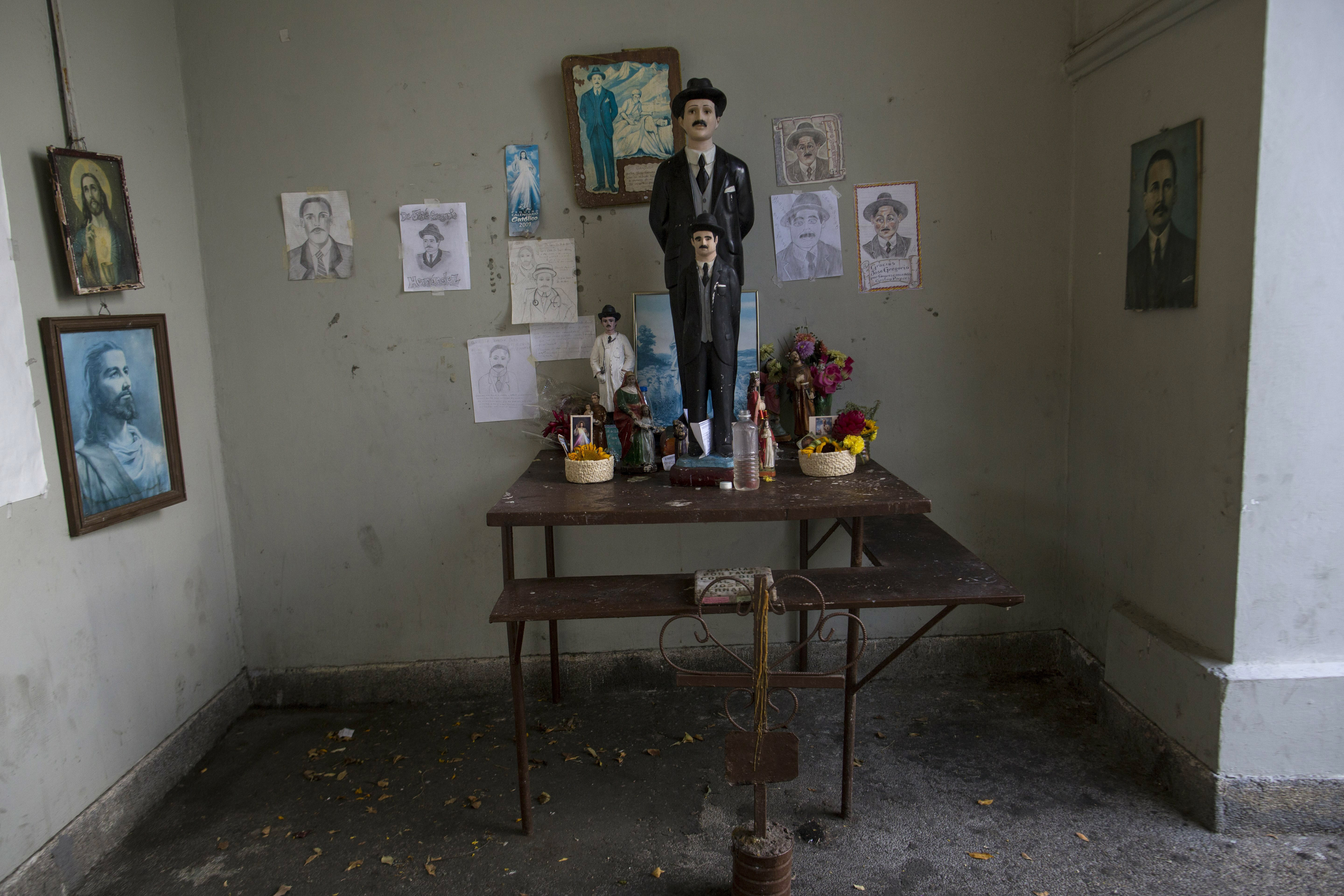 This Feb. 5, 2019 photo shows an altar adorned with drawings and statues depicting Dr. Jose Gregorio Hernandez, at the Vargas Public Hospital in Caracas, Venezuela. Hernandez was a 19th century Venezuelan doctor who treated the poor and is revered throughout the country as a saint. (AP Photo/Rodrigo Abd) This Feb. 5, 2019 photo shows an altar adorned with drawings and statues depicting Dr. Jose Gregorio Hernandez, at the Vargas Public Hospital in Caracas, Venezuela. Hernandez was a 19th century Venezuelan doctor who treated the poor and is revered throughout the country as a saint. (AP Photo/Rodrigo Abd)