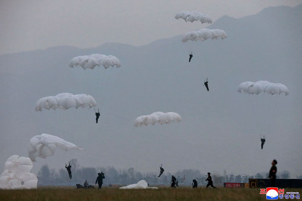 This undated photo provided on Monday, Nov. 18, 2019, by the North Korean government shows a parachuting drill of military sharpshooters at an unknown location in North Korea. North Korean leader Kim Jong Un supervised a parachuting drill of military sharpshooters and vowed to build an “invincible army,” displaying more defiance even as the United States and South Korea called off their own exercises to create space for nuclear diplomacy. Independent journalists were not given access to cover the event depicted in this image distributed by the North Korean government. The content of this image is as provided and cannot be independently verified. Korean language watermark on image as provided by source reads: This undated photo provided on Monday, Nov. 18, 2019, by the North Korean government shows a parachuting drill of military sharpshooters at an unknown location in North Korea. North Korean leader Kim Jong Un supervised a parachuting drill of military sharpshooters and vowed to build an “invincible army,” displaying more defiance even as the United States and South Korea called off their own exercises to create space for nuclear diplomacy. Independent journalists were not given access to cover the event depicted in this image distributed by the North Korean government. The content of this image is as provided and cannot be independently verified. Korean language watermark on image as provided by source reads: