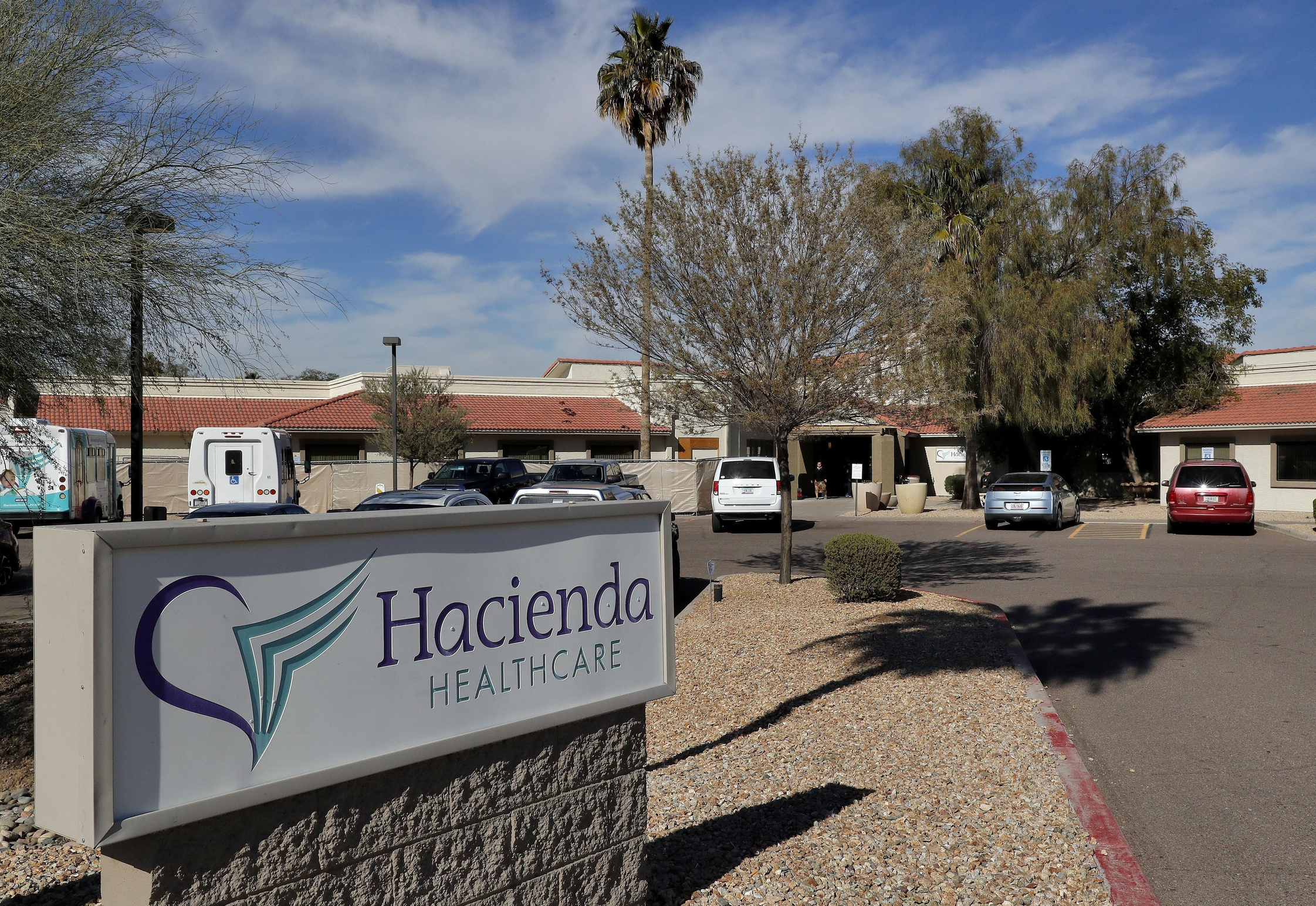 FILE - This Jan. 25, 2019, file photo shows the Hacienda HealthCare facility in Phoenix. The rape of an incapacitated woman at this facility is driving Arizona to catch up to 10 states with laws or regulations governing electronic monitoring and other technology aimed at deterring abuse inside long-term care facilities. Renewed attention on safeguarding vulnerable residents at care centers comes after an incapacitated woman gave birth at a Phoenix facility in Dec. 2018. (AP Photo/Matt York, File) FILE - This Jan. 25, 2019, file photo shows the Hacienda HealthCare facility in Phoenix. The rape of an incapacitated woman at this facility is driving Arizona to catch up to 10 states with laws or regulations governing electronic monitoring and other technology aimed at deterring abuse inside long-term care facilities. Renewed attention on safeguarding vulnerable residents at care centers comes after an incapacitated woman gave birth at a Phoenix facility in Dec. 2018. (AP Photo/Matt York, File)