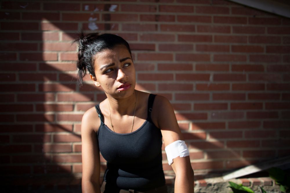 In this photo taken July 25, 2019, 18-year-old Yorselis Fajardo, who became a mother when she was 15, stands inside a clinic after she got one of the few, limited hormonal implants to prevent pregnancies, in the Caucaguita neighborhood on the outskirts of Caracas, Venezuela. A study of four hospitals last year found that over a quarter of all births recorded were to teenage mothers. (AP Photo/Ariana Cubillos) In this photo taken July 25, 2019, 18-year-old Yorselis Fajardo, who became a mother when she was 15, stands inside a clinic after she got one of the few, limited hormonal implants to prevent pregnancies, in the Caucaguita neighborhood on the outskirts of Caracas, Venezuela. A study of four hospitals last year found that over a quarter of all births recorded were to teenage mothers. (AP Photo/Ariana Cubillos)