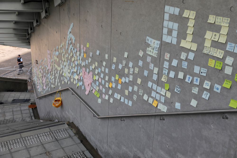 Stickers with messages supporting protesters are left on a wall near the Legislative Council in Hong Kong on Friday, June 14, 2019. Calm appeared to have returned to Hong Kong after days of protests by students and human rights activists opposed to a bill that would allow suspects to be tried in mainland Chinese courts. (AP Photo/Vincent Yu) Stickers with messages supporting protesters are left on a wall near the Legislative Council in Hong Kong on Friday, June 14, 2019. Calm appeared to have returned to Hong Kong after days of protests by students and human rights activists opposed to a bill that would allow suspects to be tried in mainland Chinese courts. (AP Photo/Vincent Yu)