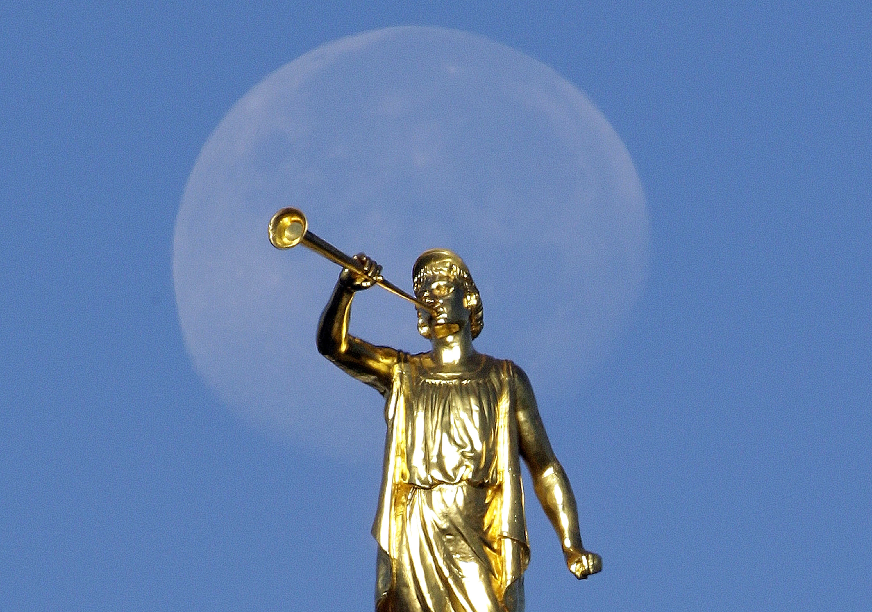 FILE - In this Sept. 11, 2014, file photo, the angel Moroni statue sits atop the Salt Lake Temple, at Temple Square, in Salt Lake City. The Mormon church won't stand in the way of a proposal to ban gay conversion therapy for minors in its home base of Utah, a position that advocates heralded as a milestone in the conservative state. (AP Photo/Rick Bowmer, File) FILE - In this Sept. 11, 2014, file photo, the angel Moroni statue sits atop the Salt Lake Temple, at Temple Square, in Salt Lake City. The Mormon church won't stand in the way of a proposal to ban gay conversion therapy for minors in its home base of Utah, a position that advocates heralded as a milestone in the conservative state. (AP Photo/Rick Bowmer, File)