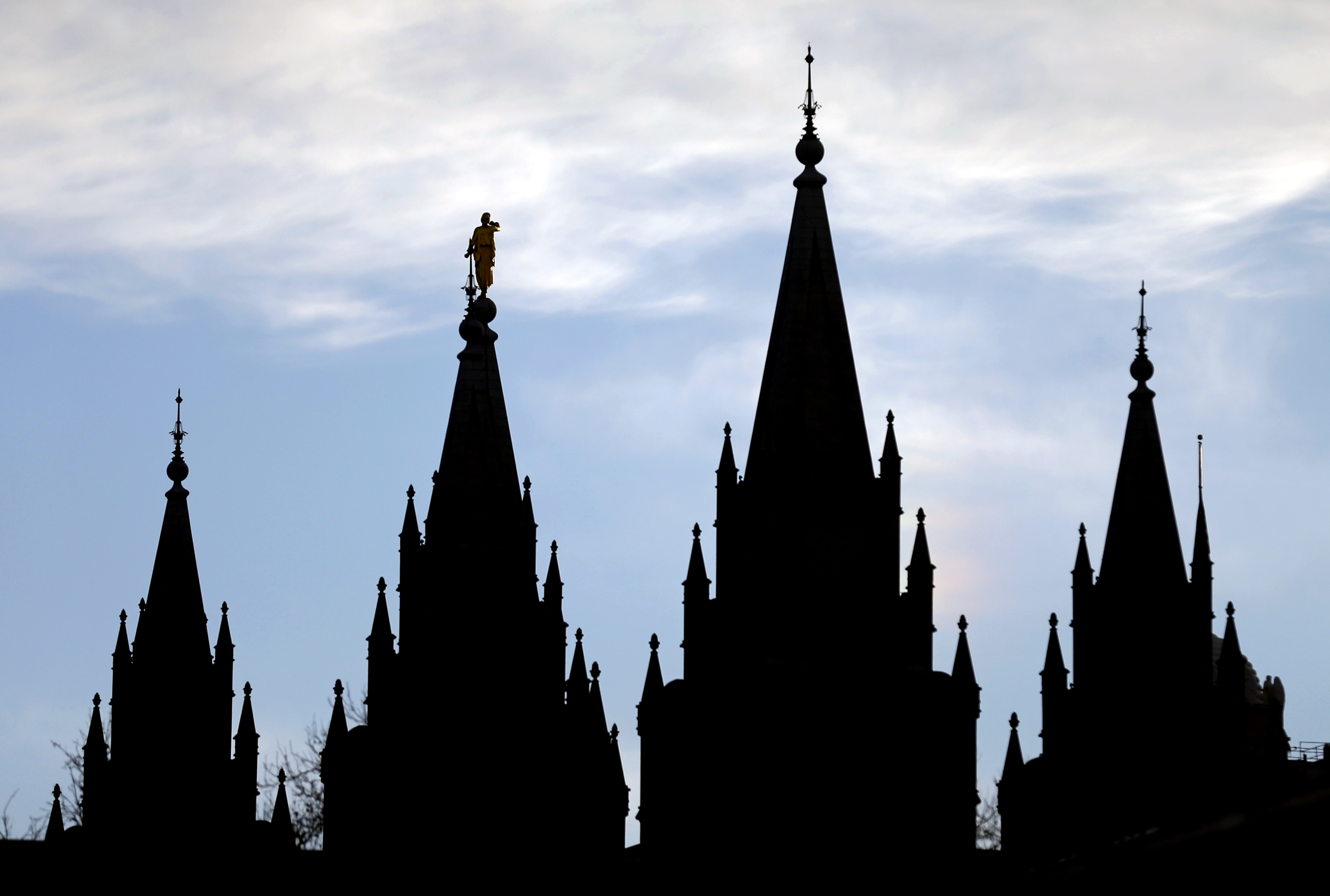 FILE- In this Jan. 3, 2018, file photo, the angel Moroni statue, silhouetted against the sky, sits atop the Salt Lake Temple at Temple Square in Salt Lake City. The Mormon church won't stand in the way of a proposal to ban gay conversion therapy for minors in its home base of Utah, a position that advocates heralded as a milestone in the conservative state. (AP Photo/Rick Bowmer, File) FILE- In this Jan. 3, 2018, file photo, the angel Moroni statue, silhouetted against the sky, sits atop the Salt Lake Temple at Temple Square in Salt Lake City. The Mormon church won't stand in the way of a proposal to ban gay conversion therapy for minors in its home base of Utah, a position that advocates heralded as a milestone in the conservative state. (AP Photo/Rick Bowmer, File)
