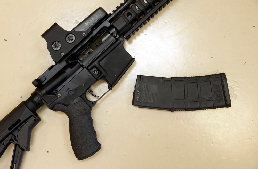 FILE - In this Oct. 3, 2013, file photo, a custom-made semi-automatic hunting rifle with a high-capacity detachable magazine is displayed at a gun store in Rocklin, Calif. California has some of the toughest gun laws in the nation, including a ban on the type of high-capacity ammunition magazines used in the nation’s three most recent public shootings, which claimed nearly three dozen lives. How long those types of laws will stand is a growing concern among gun control advocates in California and elsewhere. (AP Photo/Rich Pedroncelli, File) FILE - In this Oct. 3, 2013, file photo, a custom-made semi-automatic hunting rifle with a high-capacity detachable magazine is displayed at a gun store in Rocklin, Calif. California has some of the toughest gun laws in the nation, including a ban on the type of high-capacity ammunition magazines used in the nation’s three most recent public shootings, which claimed nearly three dozen lives. How long those types of laws will stand is a growing concern among gun control advocates in California and elsewhere. (AP Photo/Rich Pedroncelli, File)