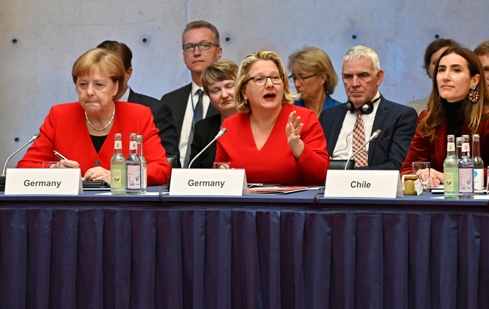 German Chancellor Angela Merkel, from left, and German Environment Minister Svenja Schulze and Chilean Environment Minister Carolina Schmidt attend the 10th Petersberger Klimadialog climate conference in Berlin, Germany, Tuesday, May 14, 2019. (Tobias Schwarz/Pool via AP) German Chancellor Angela Merkel, from left, and German Environment Minister Svenja Schulze and Chilean Environment Minister Carolina Schmidt attend the 10th Petersberger Klimadialog climate conference in Berlin, Germany, Tuesday, May 14, 2019. (Tobias Schwarz/Pool via AP)
