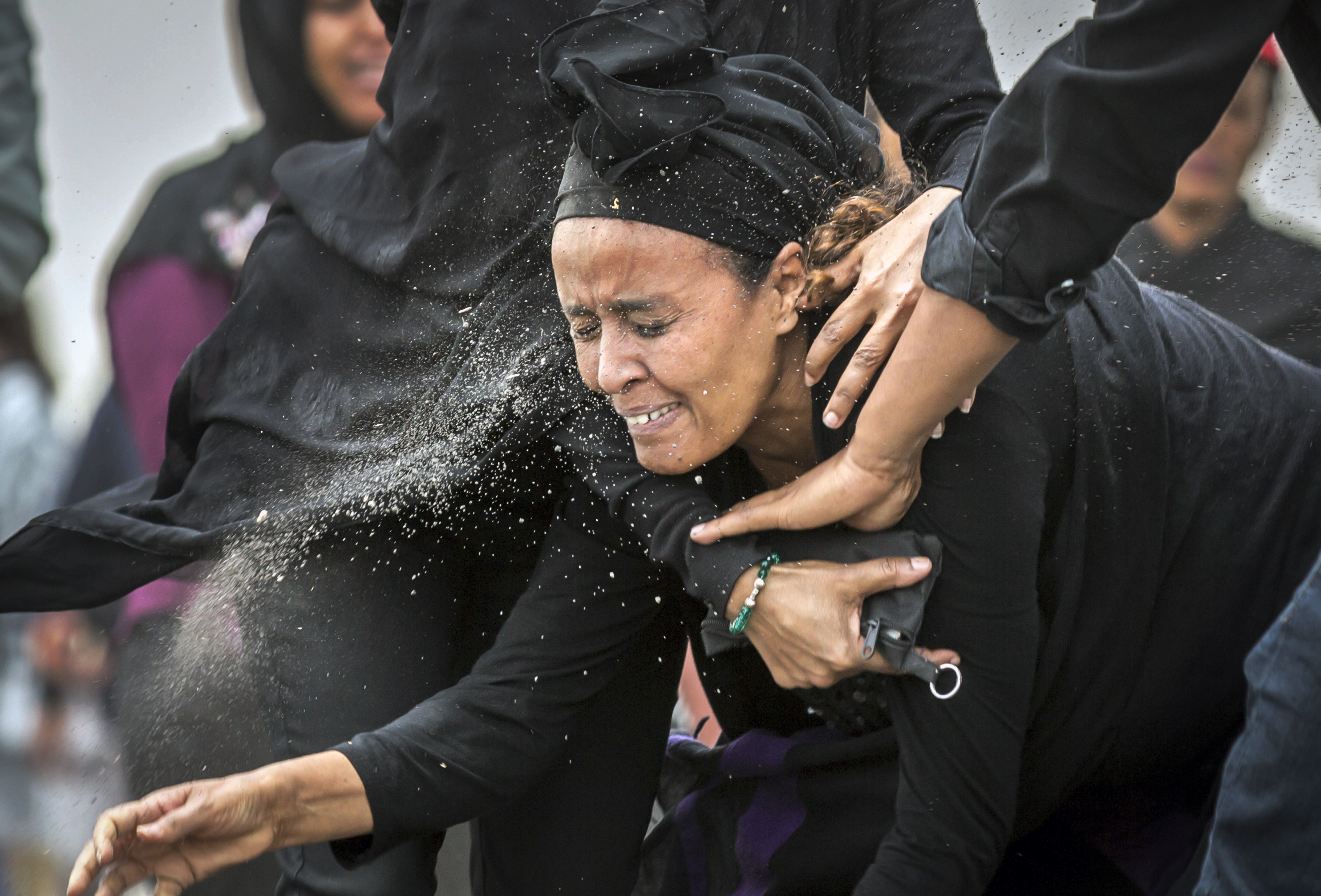 An Ethiopian relative of a crash victim throws dirt in her own face after realising that there is nothing physical left of her loved one, as she mourns at the scene where the Ethiopian Airlines Boeing 737 Max 8 crashed shortly after takeoff on Sunday killing all 157 on board, near Bishoftu, south-east of Addis Ababa, in Ethiopia Thursday, March 14, 2019. About 200 family members of people who died on the crashed jet stormed out of a briefing with Ethiopian Airlines officials in Addis Ababa on Thursday, complaining that the airline has not given them adequate information. (AP Photo/Mulugeta Ayene) An Ethiopian relative of a crash victim throws dirt in her own face after realising that there is nothing physical left of her loved one, as she mourns at the scene where the Ethiopian Airlines Boeing 737 Max 8 crashed shortly after takeoff on Sunday killing all 157 on board, near Bishoftu, south-east of Addis Ababa, in Ethiopia Thursday, March 14, 2019. About 200 family members of people who died on the crashed jet stormed out of a briefing with Ethiopian Airlines officials in Addis Ababa on Thursday, complaining that the airline has not given them adequate information. (AP Photo/Mulugeta Ayene)