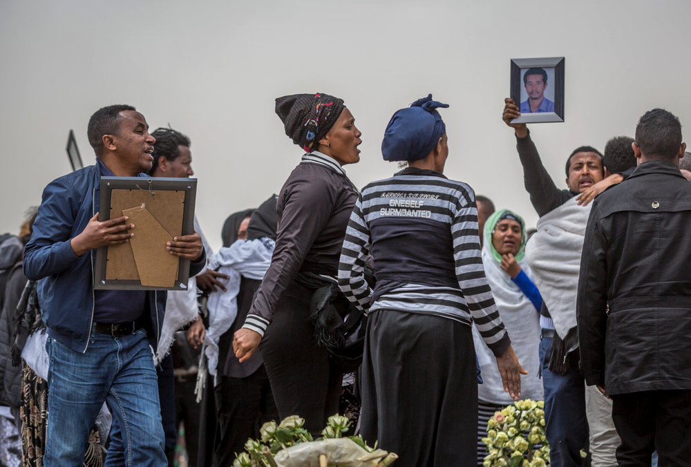 Ethiopian relatives of crash victims mourn at the scene where the Ethiopian Airlines Boeing 737 Max 8 crashed shortly after takeoff on Sunday killing all 157 on board, near Bishoftu, south-east of Addis Ababa, in Ethiopia Thursday, March 14, 2019. About 200 family members of people who died on the crashed jet stormed out of a briefing with Ethiopian Airlines officials in Addis Ababa on Thursday, complaining that the airline has not given them adequate information. (AP Photo/Mulugeta Ayene) Ethiopian relatives of crash victims mourn at the scene where the Ethiopian Airlines Boeing 737 Max 8 crashed shortly after takeoff on Sunday killing all 157 on board, near Bishoftu, south-east of Addis Ababa, in Ethiopia Thursday, March 14, 2019. About 200 family members of people who died on the crashed jet stormed out of a briefing with Ethiopian Airlines officials in Addis Ababa on Thursday, complaining that the airline has not given them adequate information. (AP Photo/Mulugeta Ayene)
